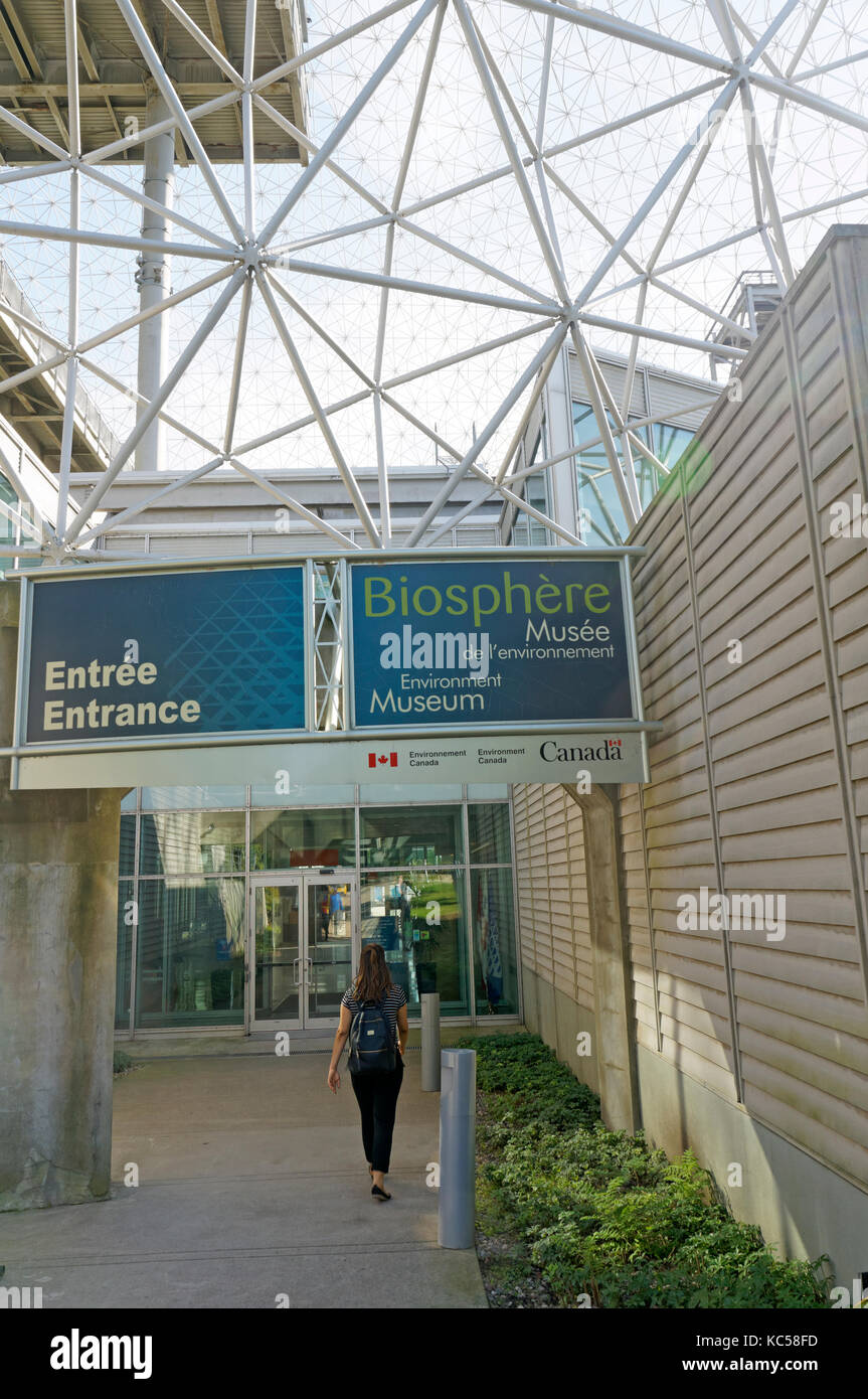 Woman entering the Montreal Biosphere Environment Museum  in Parc Jean Drapeau, Ile Sainte-Helene, Montreal, Quebec, Canada Stock Photo