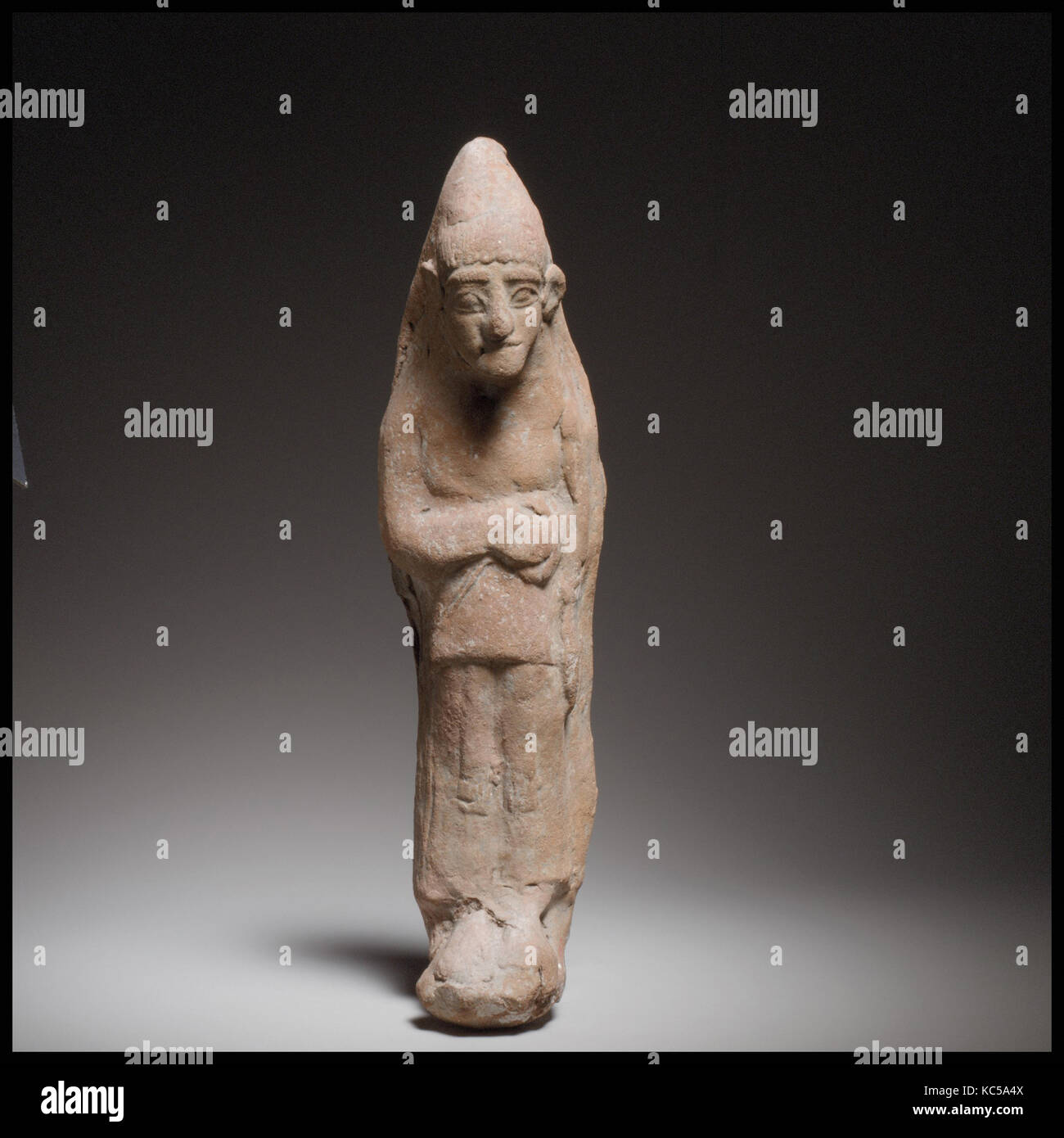 Standing female figurine, Cypro-Archaic II, ca. 600–480 B.C., Cypriot, Terracotta; mold-made, H. 10 7/8 in. (27.6 cm Stock Photo