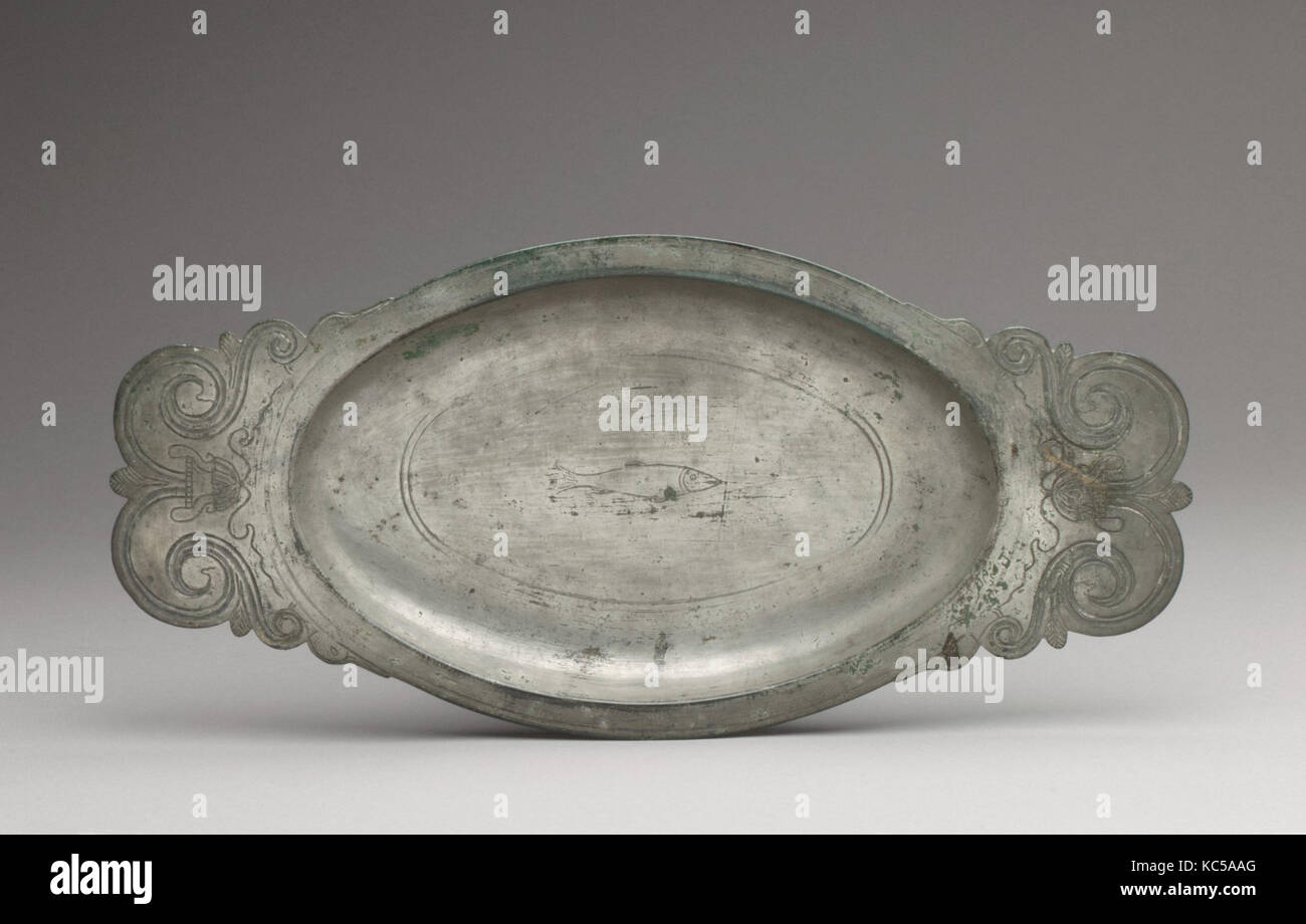 Platter with a Fish, 4th–5th century, Late Roman, Bronze, silver overlaid, Overall: 7/8 x 15 1/16 x 7 3/16 in. (2.2 x 38.2 x 18 Stock Photo