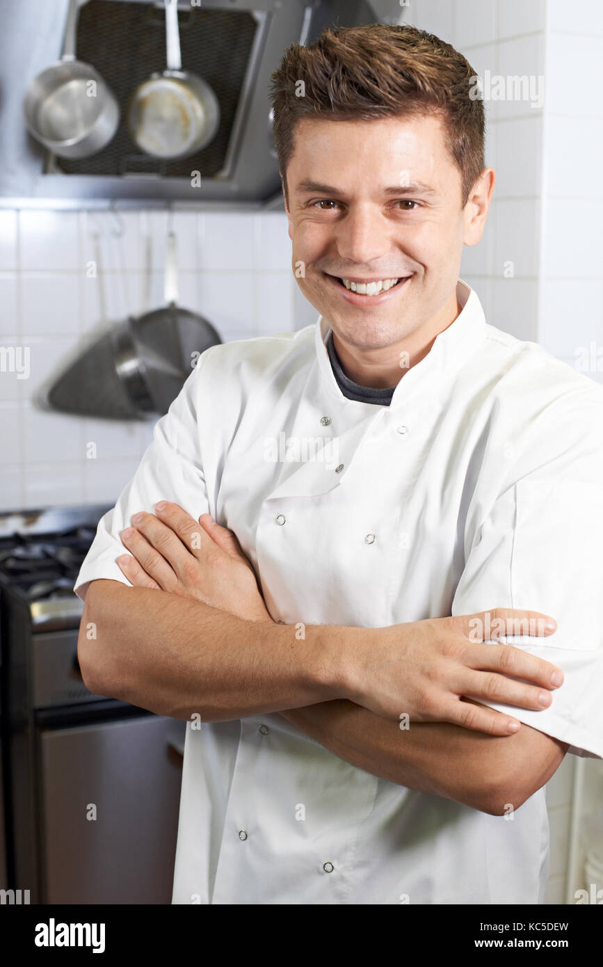 Portrait Of Male Chef Standing In Kitchen Stock Photo Alamy