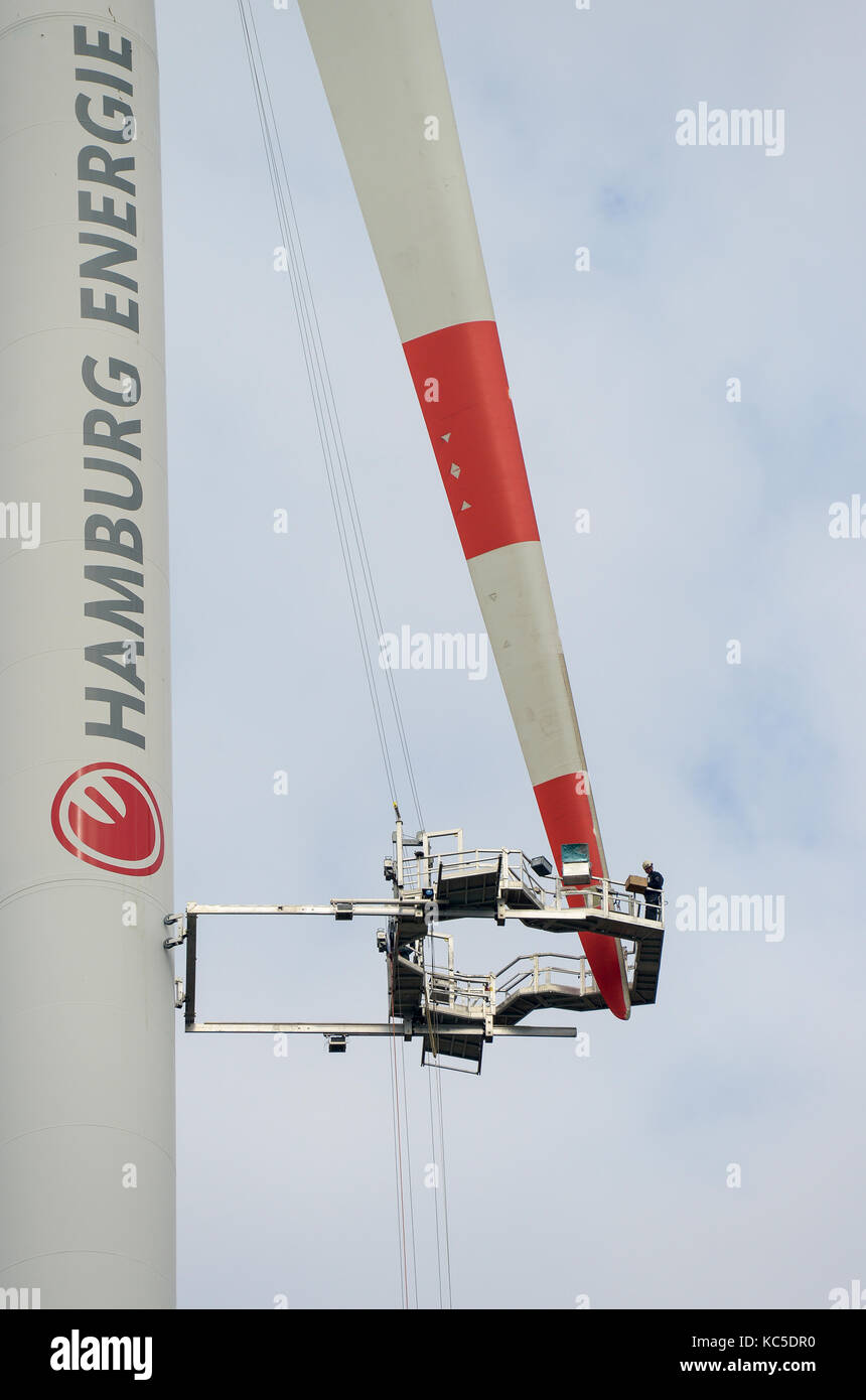 GERMANY, Hamburg, rotor blade service with special crane construction at Nordex wind turbine, authentic Stock Photo