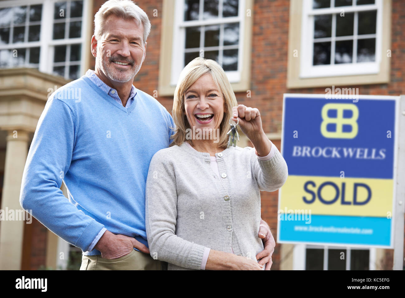 Middle aged woman holding sign hi-res stock photography and images - Alamy