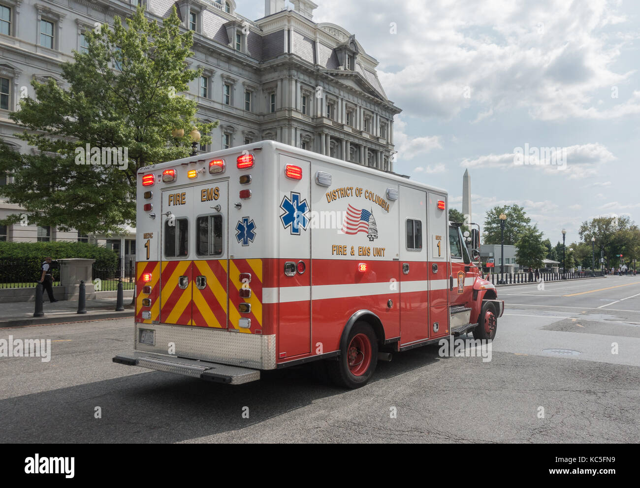 EMS ambulance responding, Washington Monument and Executive Office Building background. EMS is