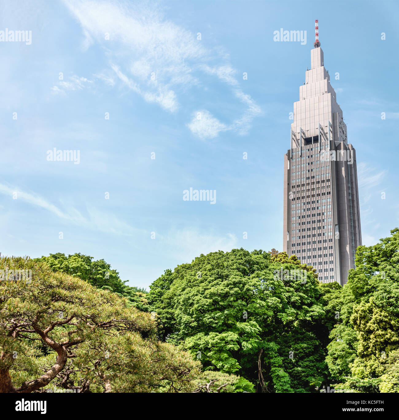 NTT Docomo Yoyogi Building seen from Shinjuku Gyoen National Garden, Tokyo, Japan Stock Photo
