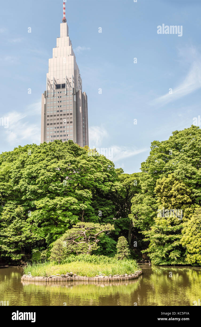 NTT Docomo Yoyogi Building seen from Shinjuku Gyoen National Garden, Tokyo, Japan Stock Photo