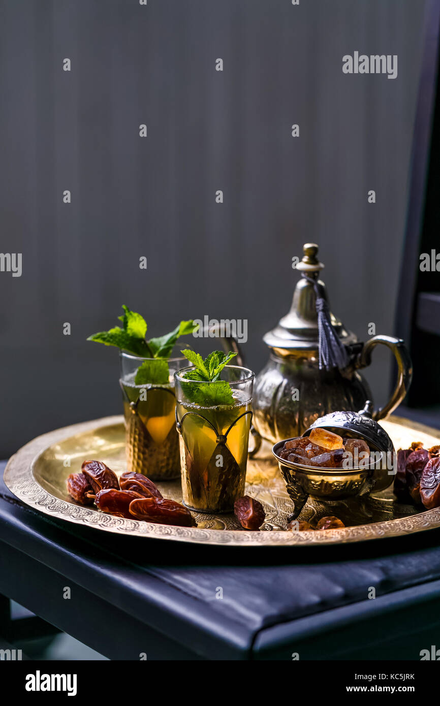 Moroccan mint tea in the traditional glasses on a tray and kettle Stock ...