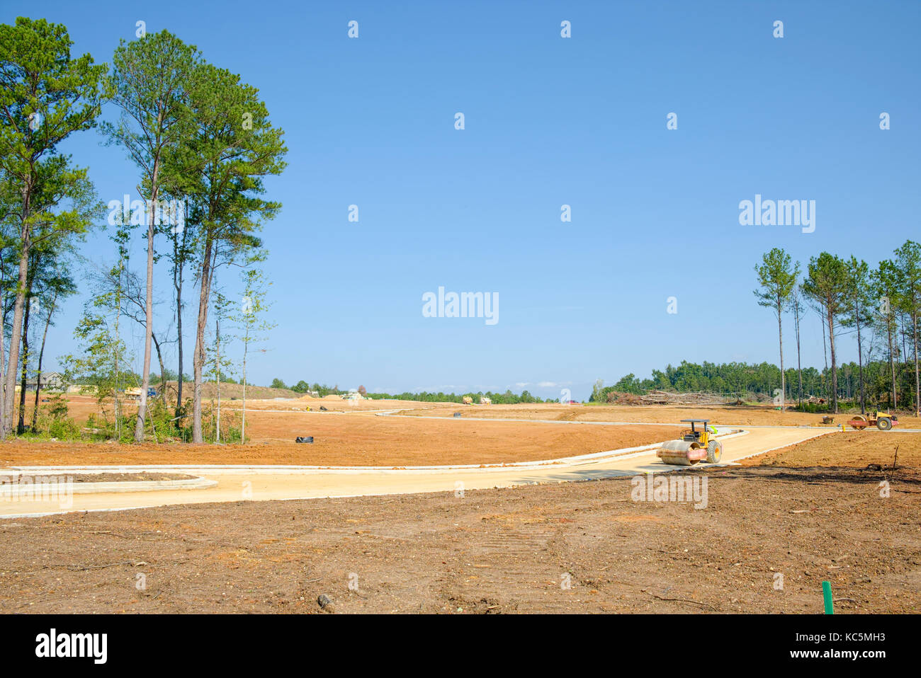 Large new residential subdivision construction site work, clearing the land and building roads for new homes in Pike Road, Alabama USA. Stock Photo