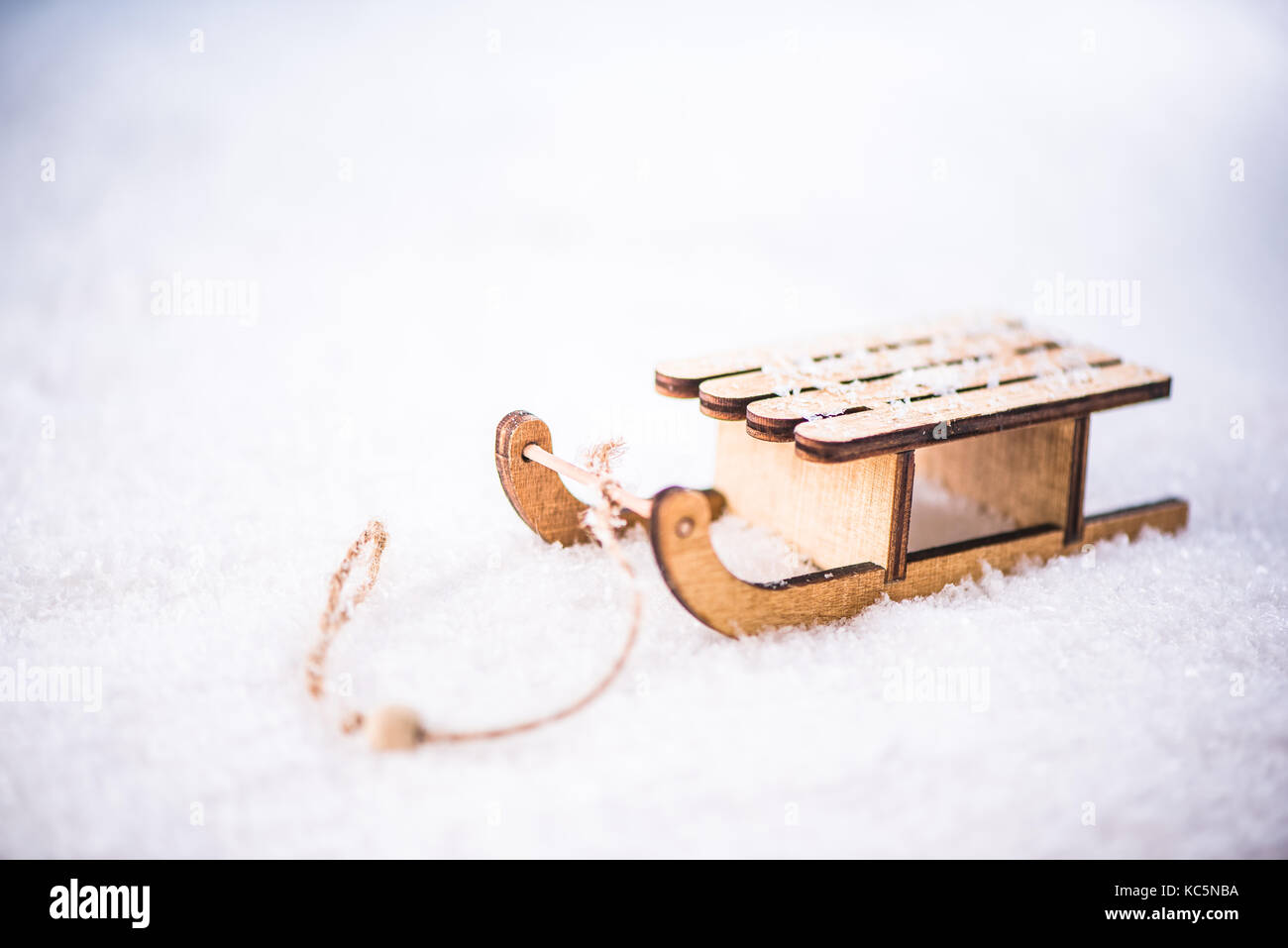 Vintage wooden snow sledge in snow Stock Photo - Alamy