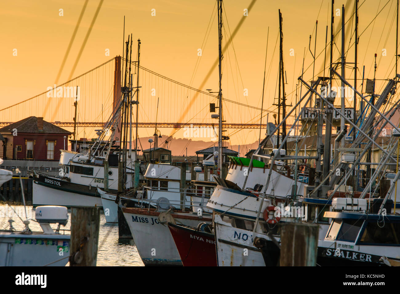 Fisherman's Wharf and the Golden Gate Bridge at sunset, San Francisco, California Stock Photo