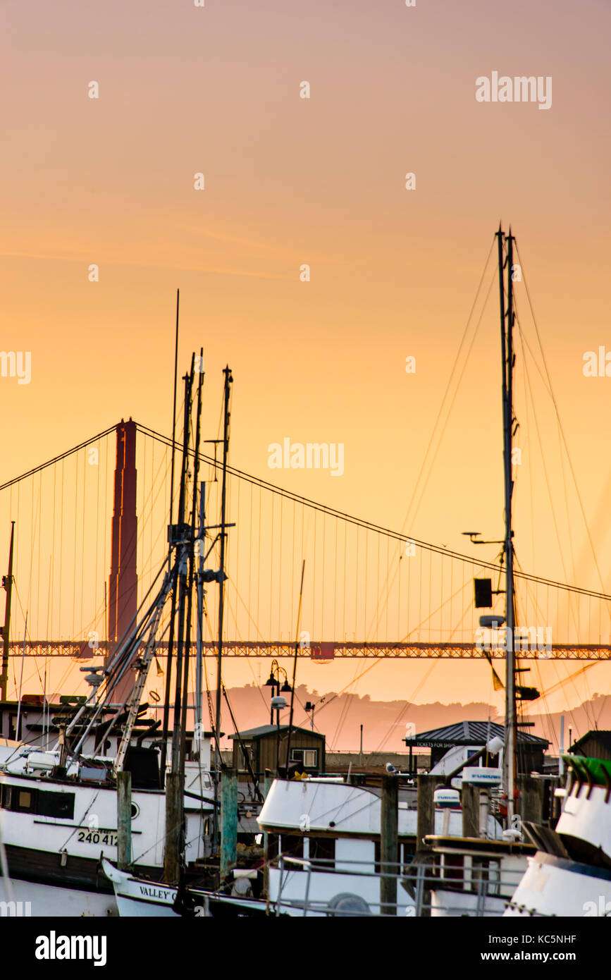 Fisherman's Wharf and the Golden Gate Bridge at sunset, San Francisco, California Stock Photo