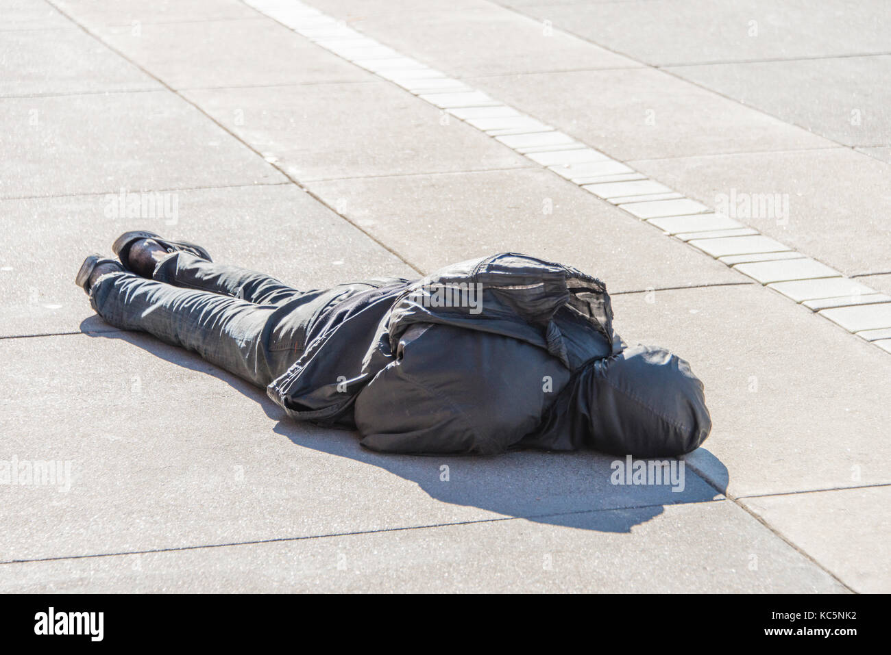 Homeless man sleeping on street, San Francisco, California Stock Photo