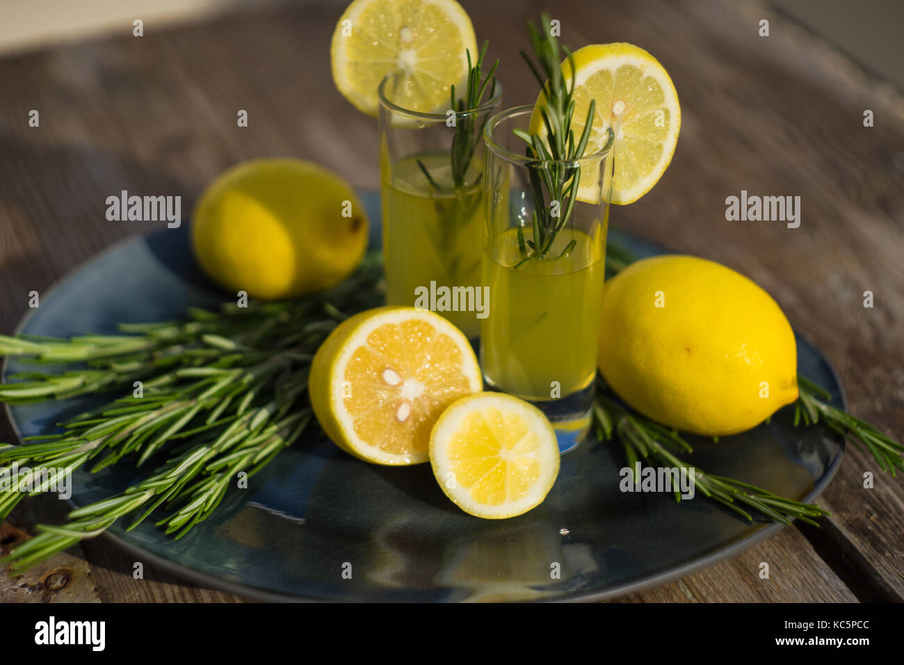 Traditional italian lemon alcohol drink limoncello with pieces of lemon