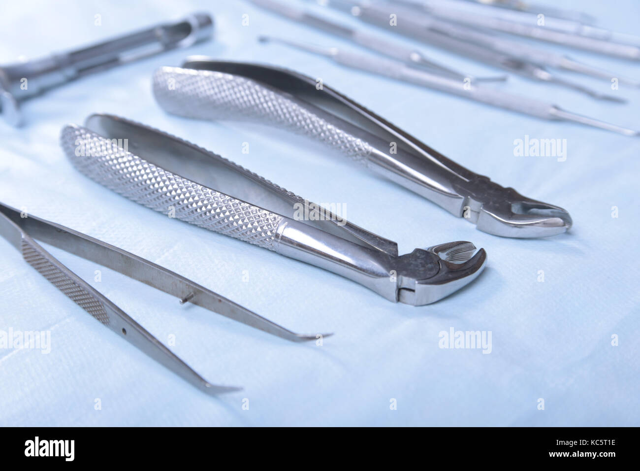 Medical instruments for dentists on blue table Stock Photo Alamy