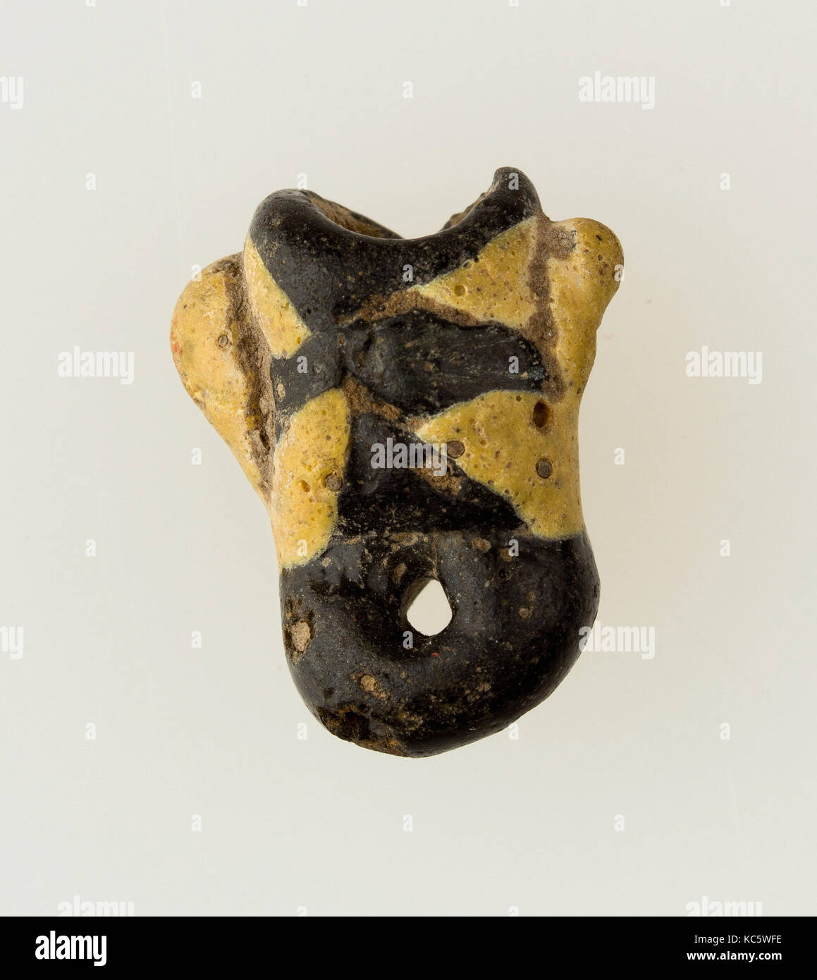 Amulet in form of human face, Ptolemaic or Roman Period, 304 B.C.–A.D. 364, From Egypt, Northern Upper Egypt, Abadiya or Hiw Stock Photo