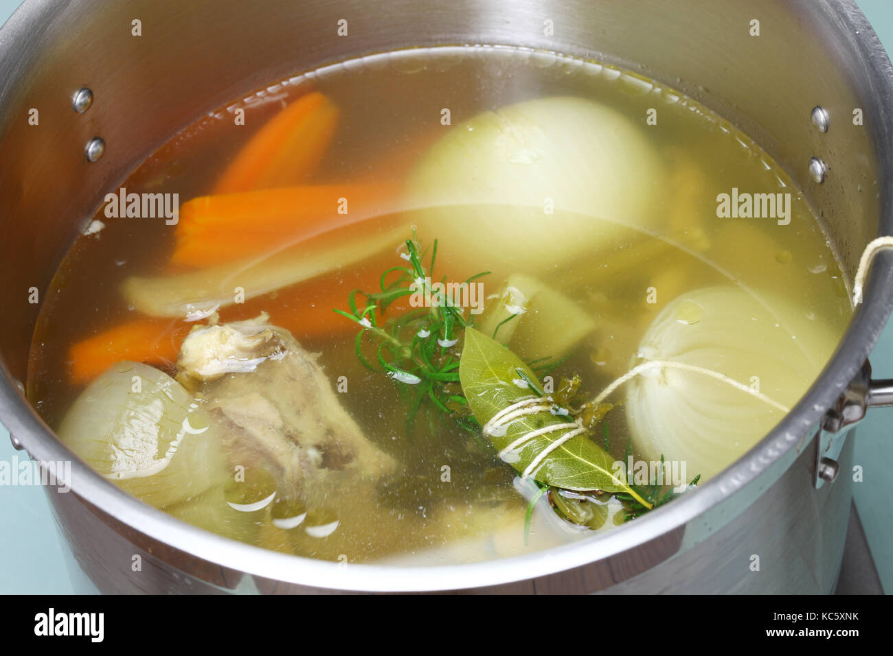 making chicken soup stock (bouillon) in a pot Stock Photo