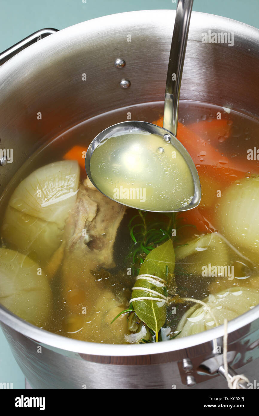 making chicken soup stock (bouillon) in a pot Stock Photo