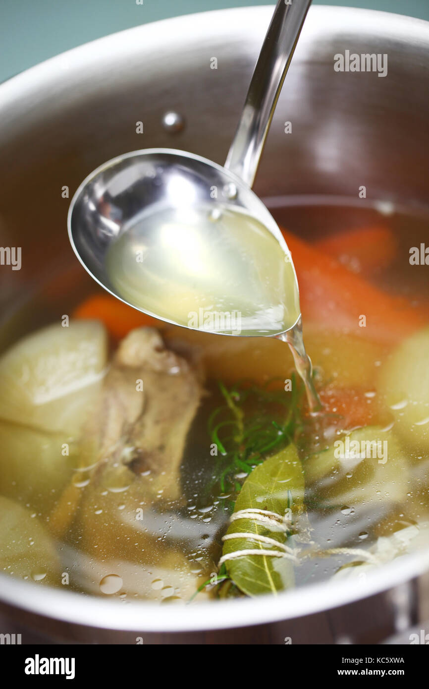 making chicken soup stock (bouillon) in a pot Stock Photo