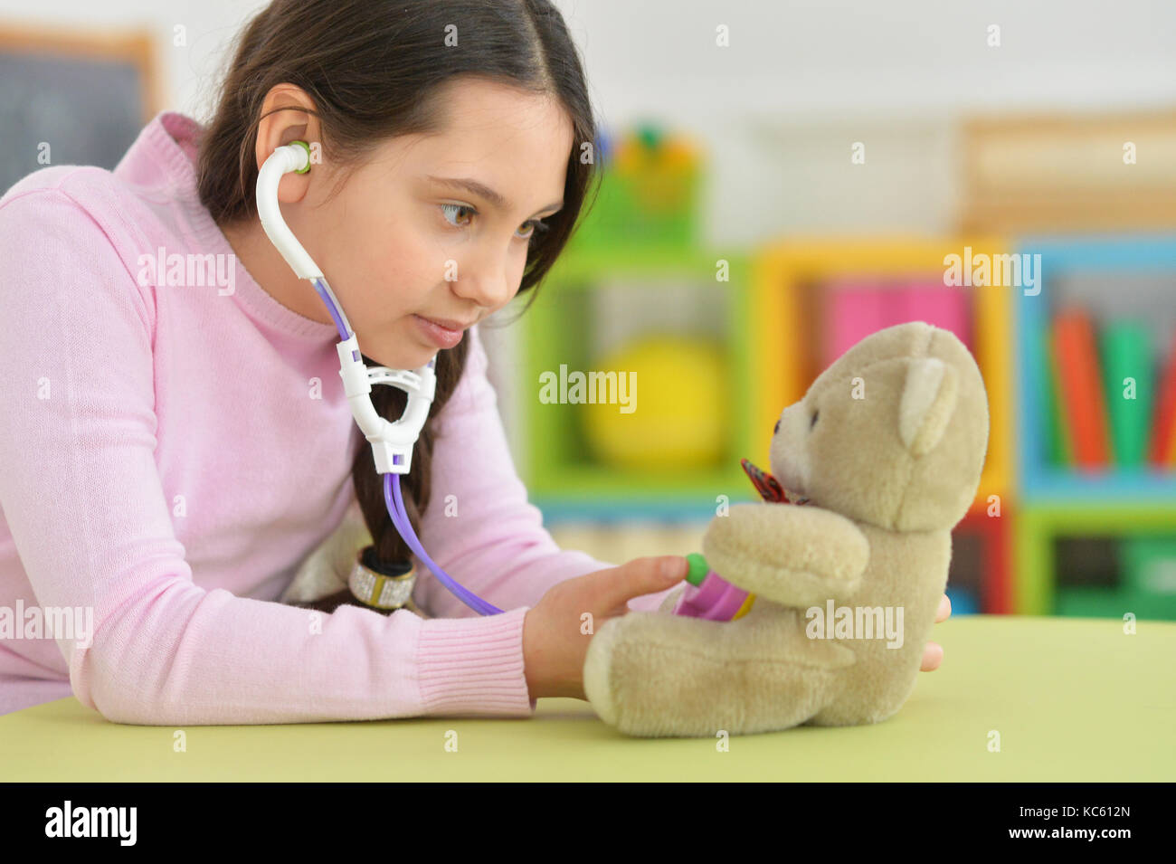 Cute little girl playing nurse Stock Photo - Alamy