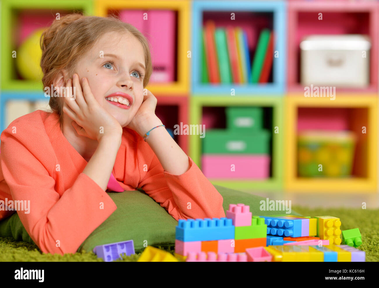 girl playing with plastic blocks Stock Photo - Alamy