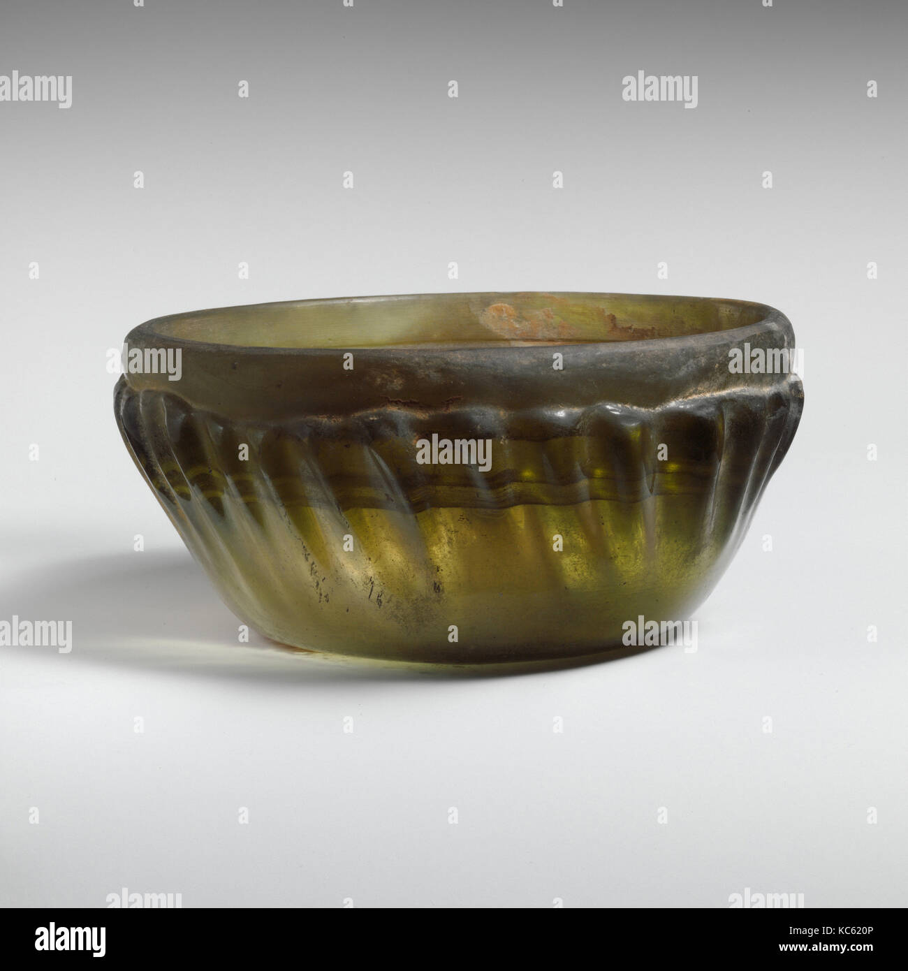 Glass ribbed bowl, Late Hellenistic, 1st century B.C., Greek, Eastern Mediterranean, Glass; cast, tooled, and cut, H.: 2 9/16 Stock Photo