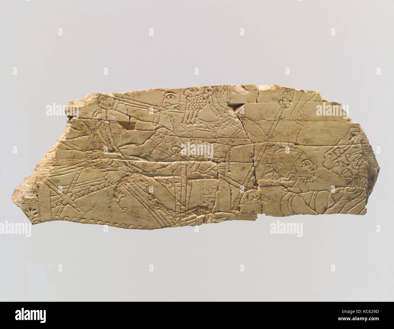 Plaque fragment with battle scene, ca. 9th century B.C Stock Photo