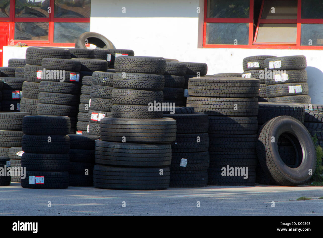 Tires for sale at a tire store stacks of new tires Stock Photo Alamy