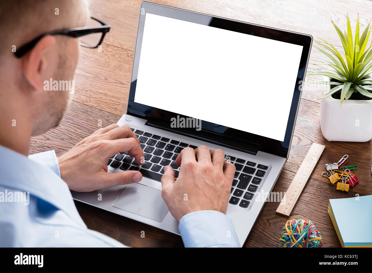 Business Person Using Laptop Computer Showing Blank Screen On Wooden ...