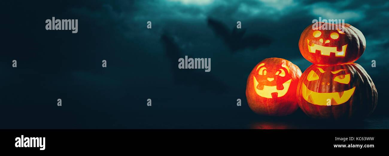 Three halloween Jack O' Lantern pumpkins Stock Photo - Alamy
