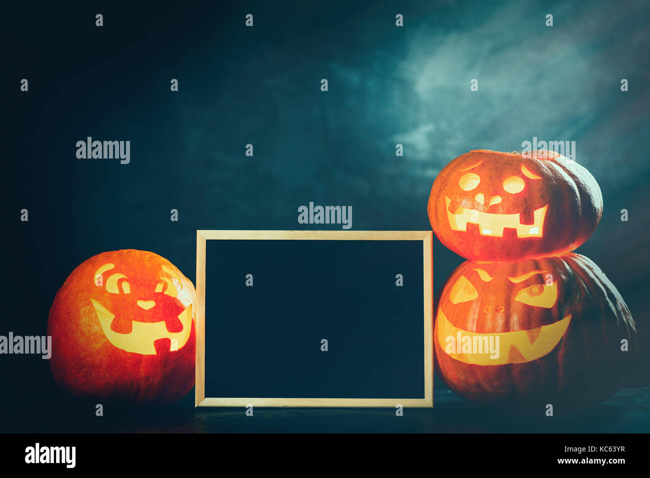 Three halloween Jack O' Lantern pumpkins Stock Photo - Alamy