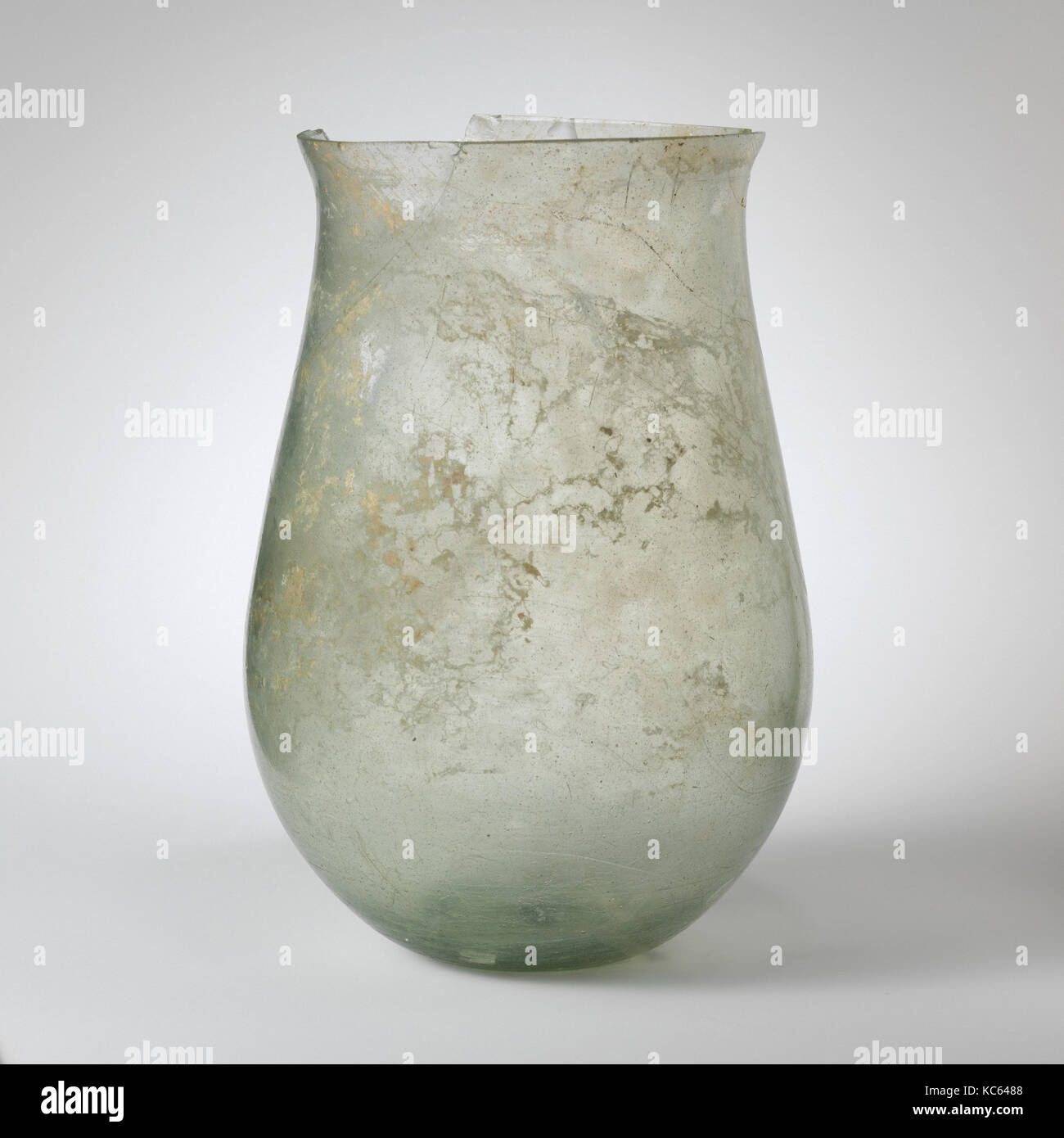 Glass jar, Imperial, 1st–3rd century A.D., Roman, Glass; blown and cut, H.: 10 1/16 in. (25.6 cm), Glass, Translucent pale green Stock Photo