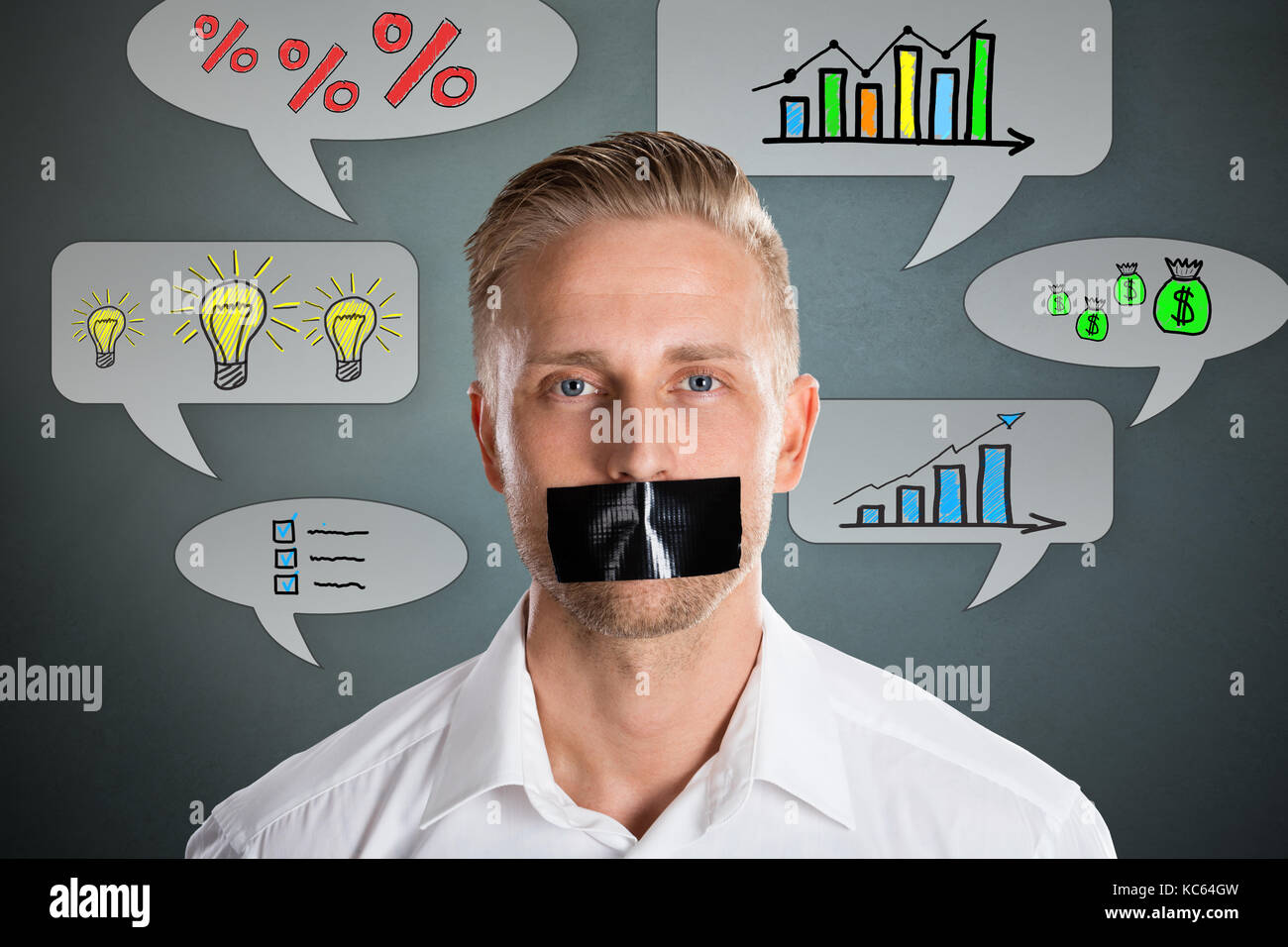Businessman With Black Duct Tape Over His Mouth With Business Symbol At Background Stock Photo