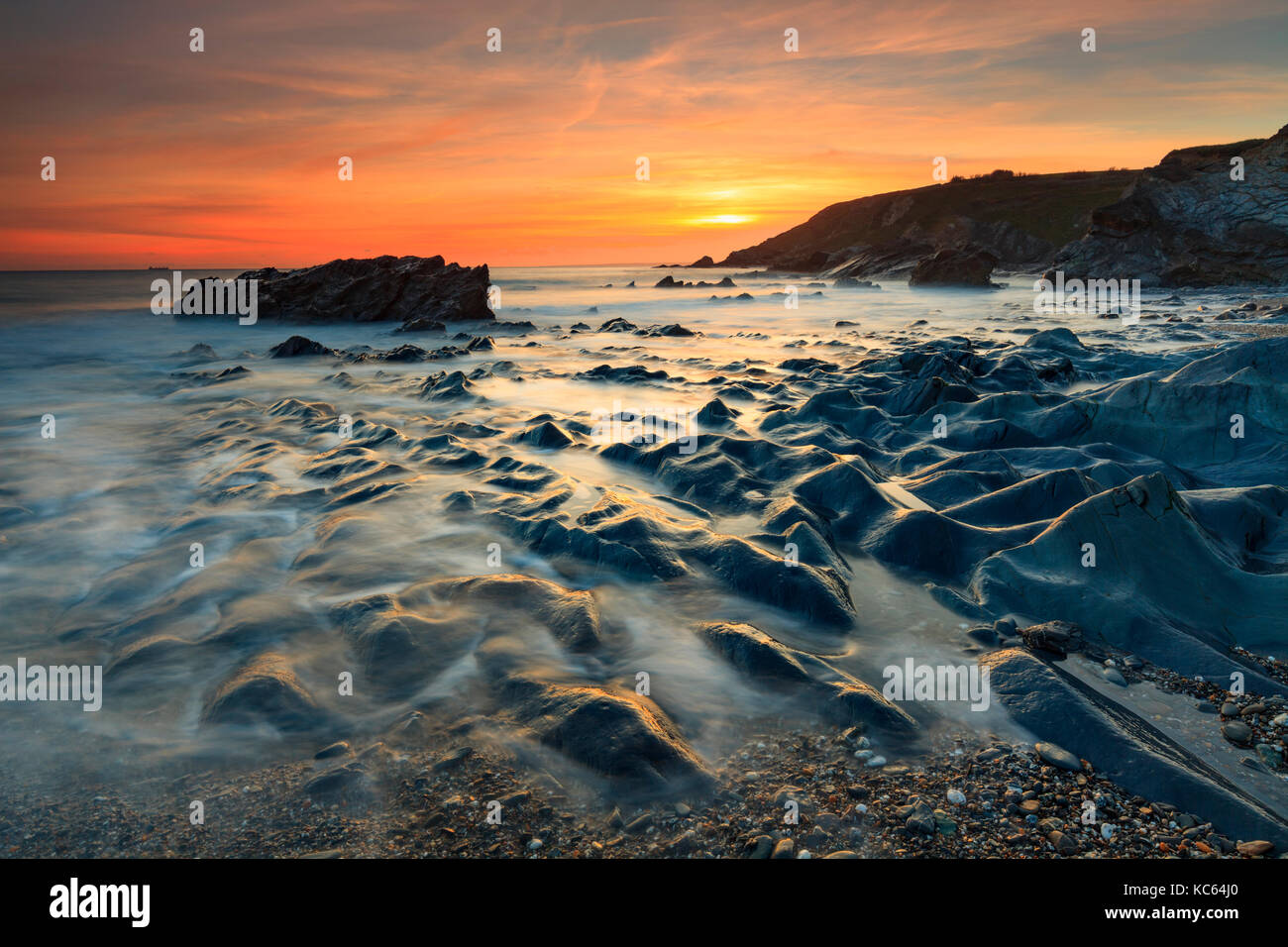 Sunset captured from Dollar Cove at Gunwalloe in Cornwall. Stock Photo