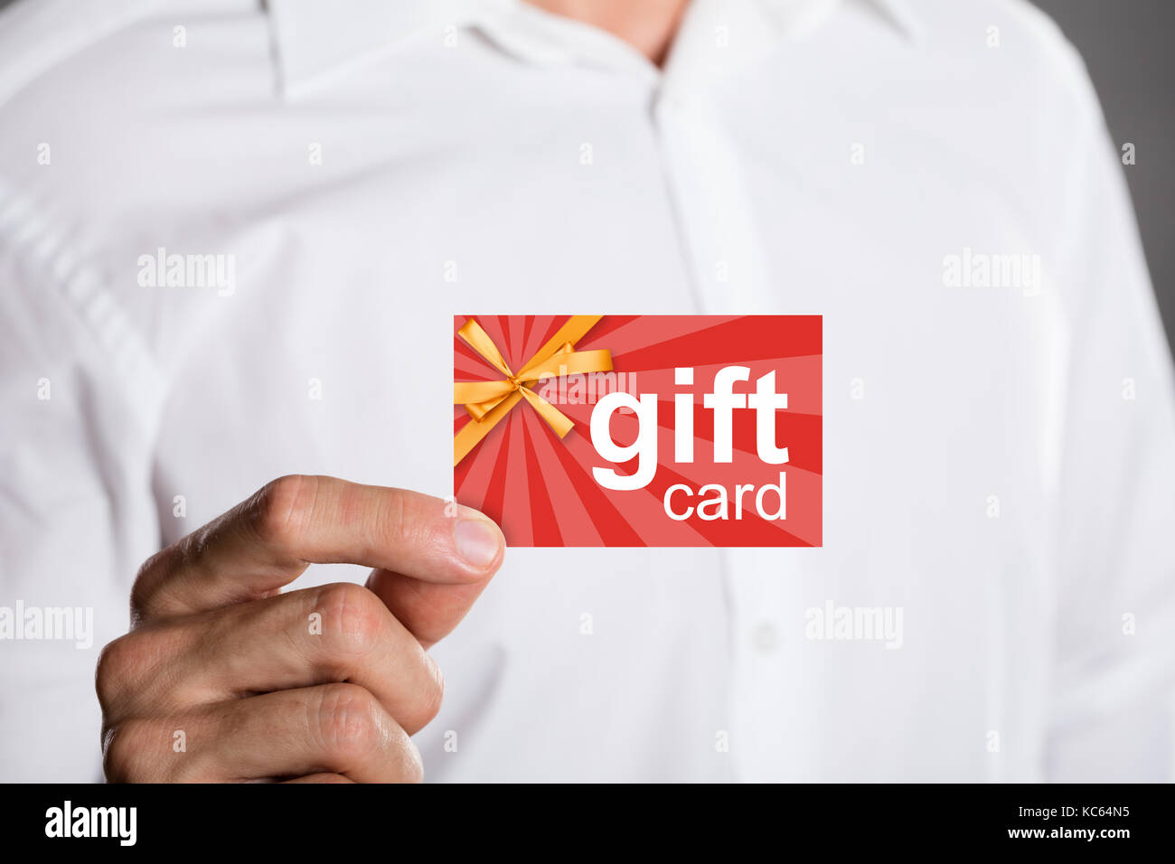 Close-up Of A Man Holding Prepaid Gift Card Stock Photo