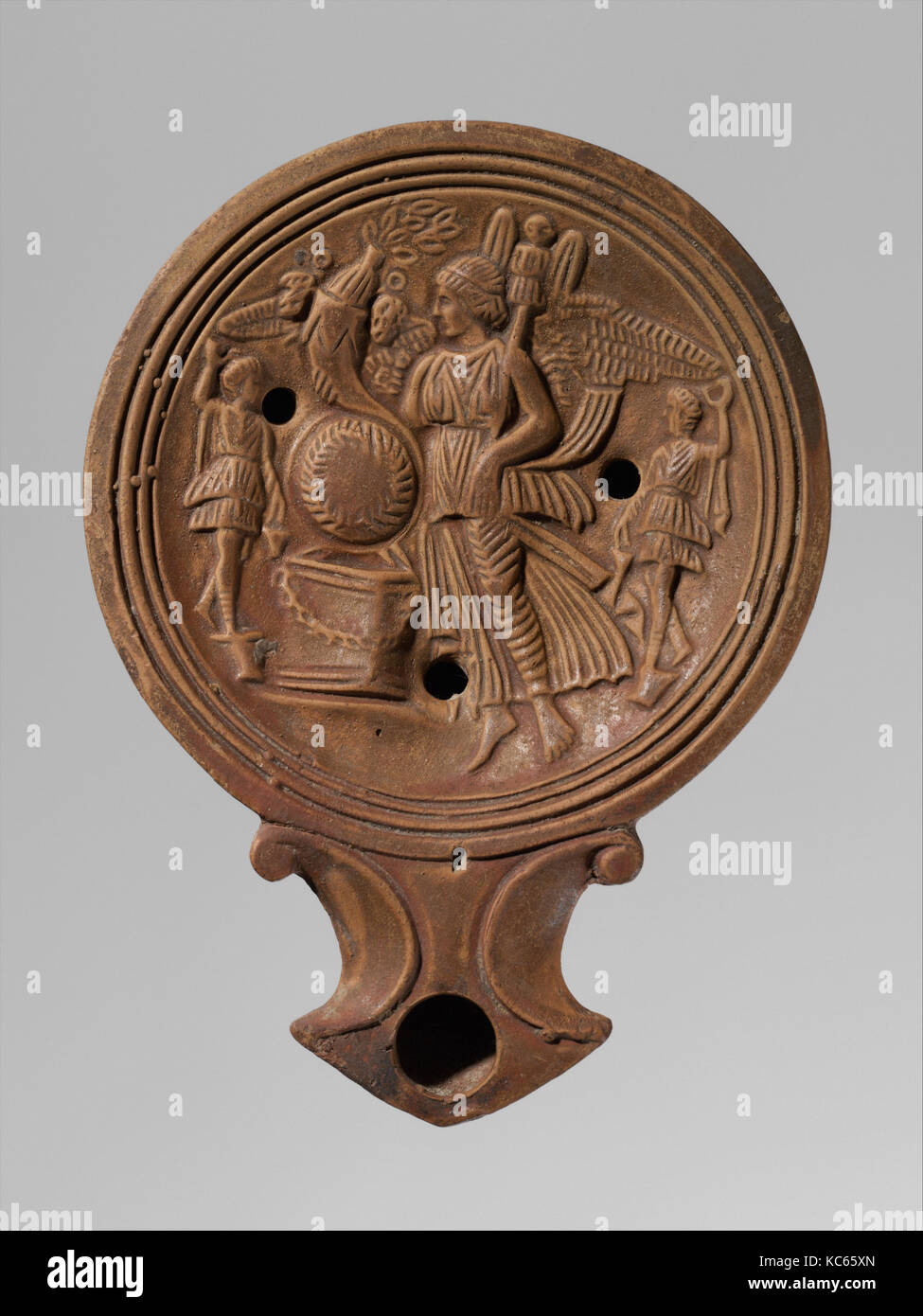 Terracotta oil lamp, Early Imperial, 1st century A.D., Roman, Terracotta; mold-made, H. 1 in. (2.5 cm); length 4 9/16 in. (11.6 Stock Photo