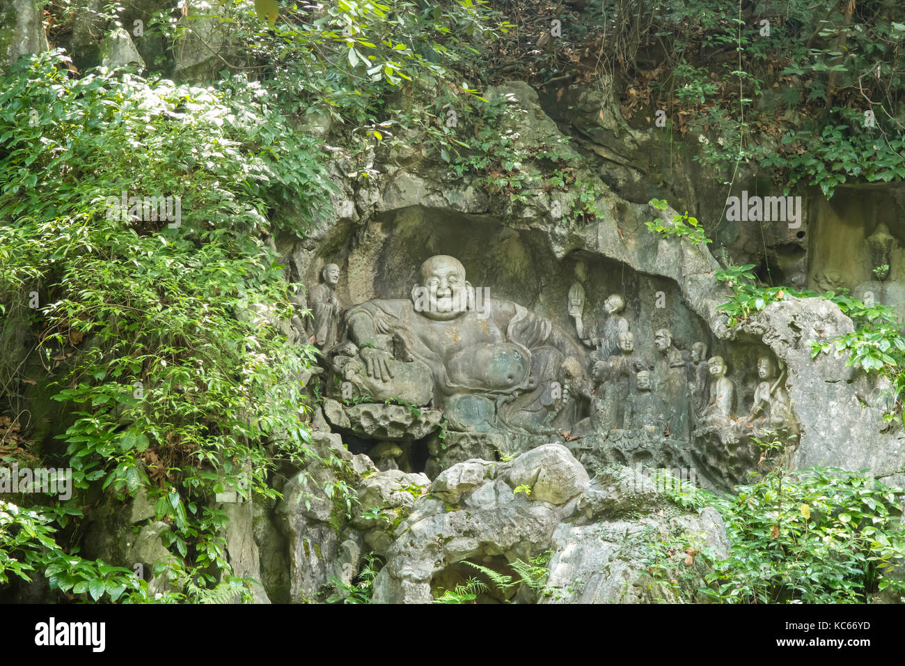 Rock Carved Happy Buddha at Lingyin Temple, Hangzhou, China Stock Photo