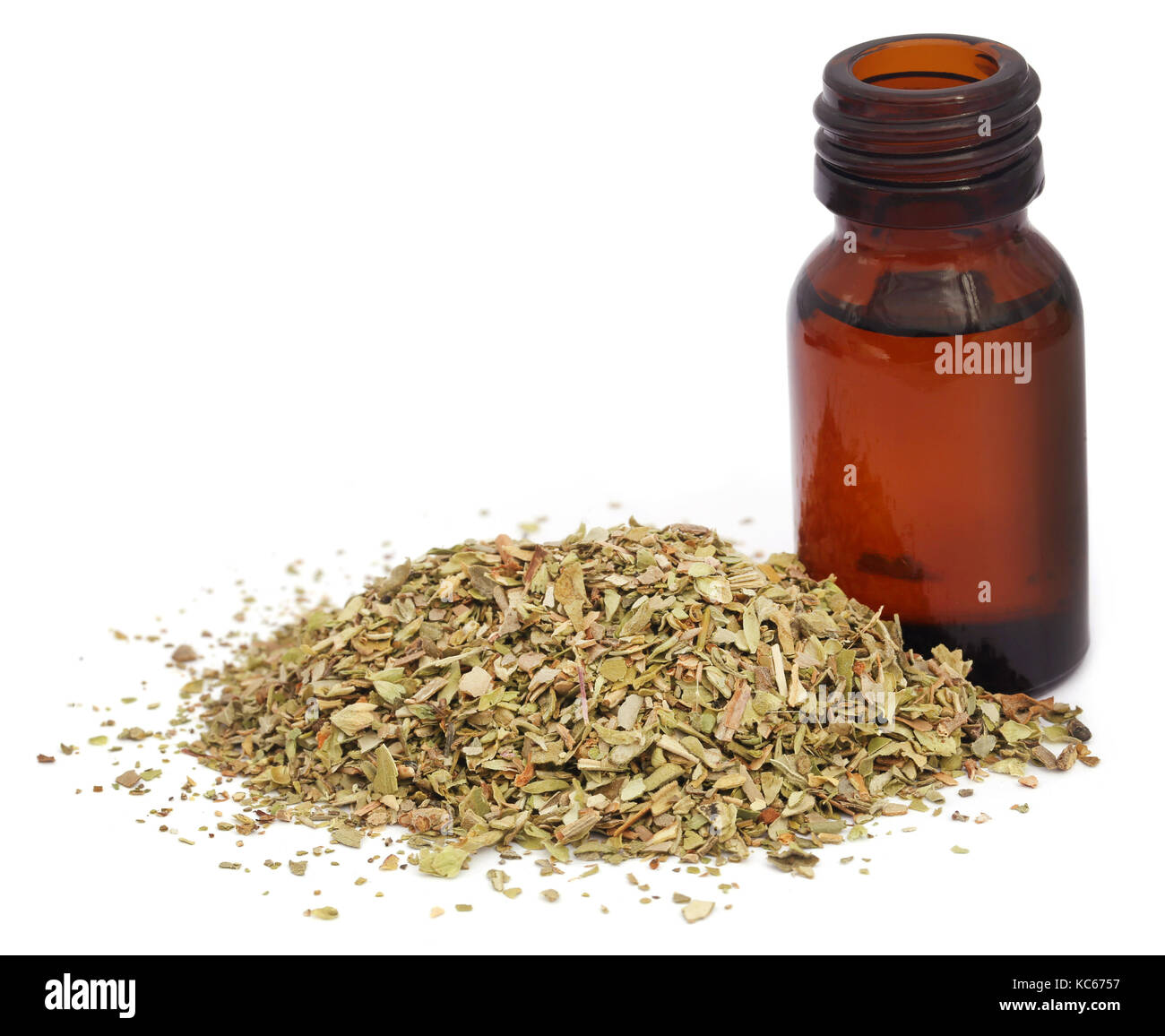 Dry oregano and essential oil in an amber bottle Stock Photo