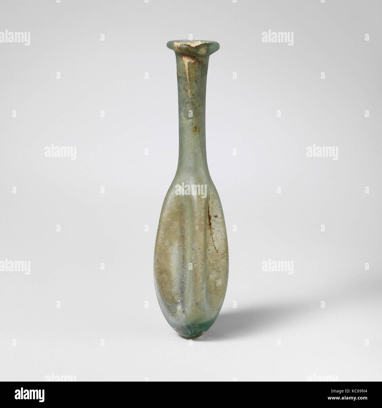 Glass perfume bottle, Mid Imperial, 2nd–3rd century A.D., Roman, Glass; blown, 4 5/8 x 7/8in. (11.7 x 2.3cm), Glass, Translucent Stock Photo