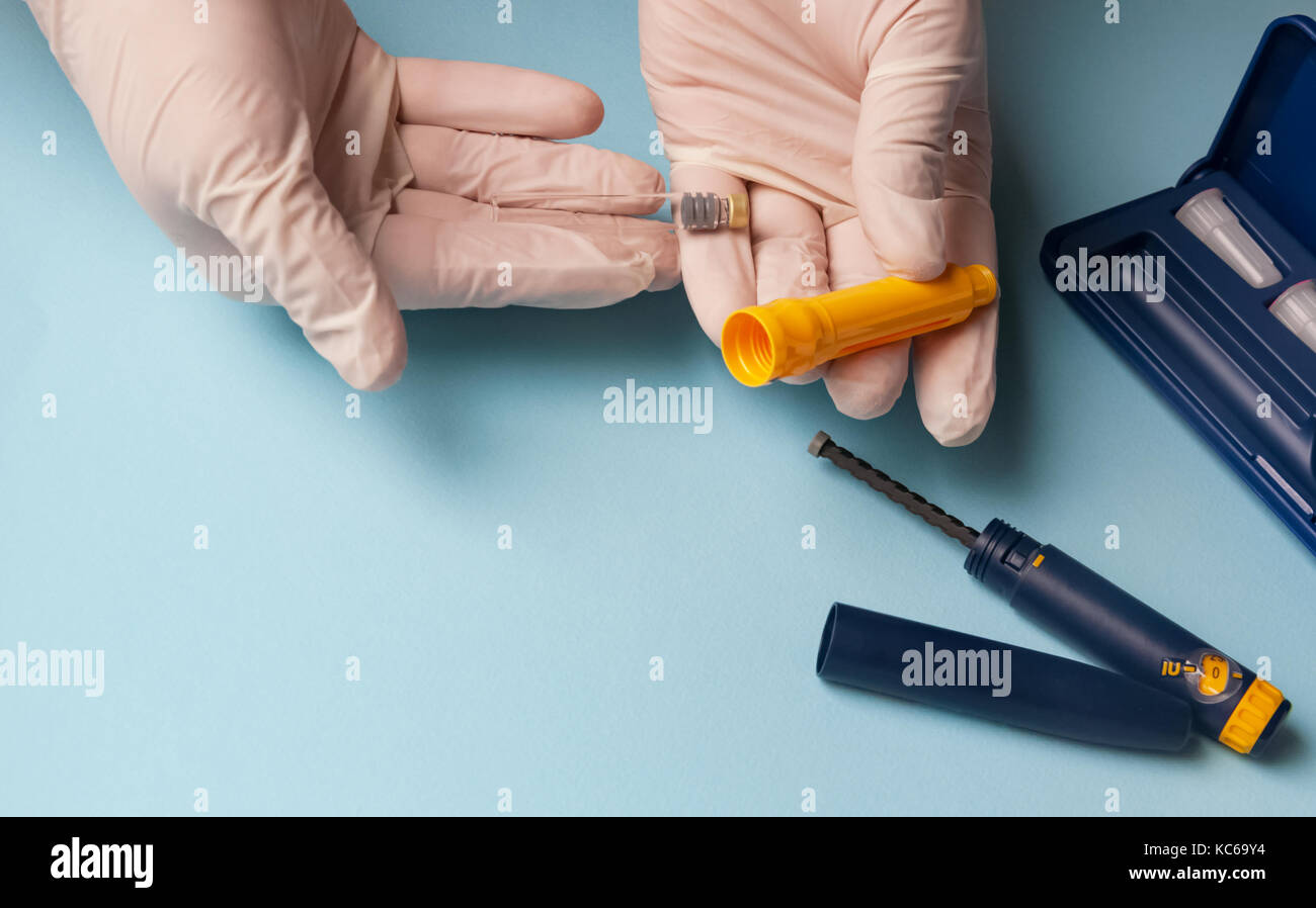 A man holds a syringe for subcutaneous injection of hormonal drugs in ...