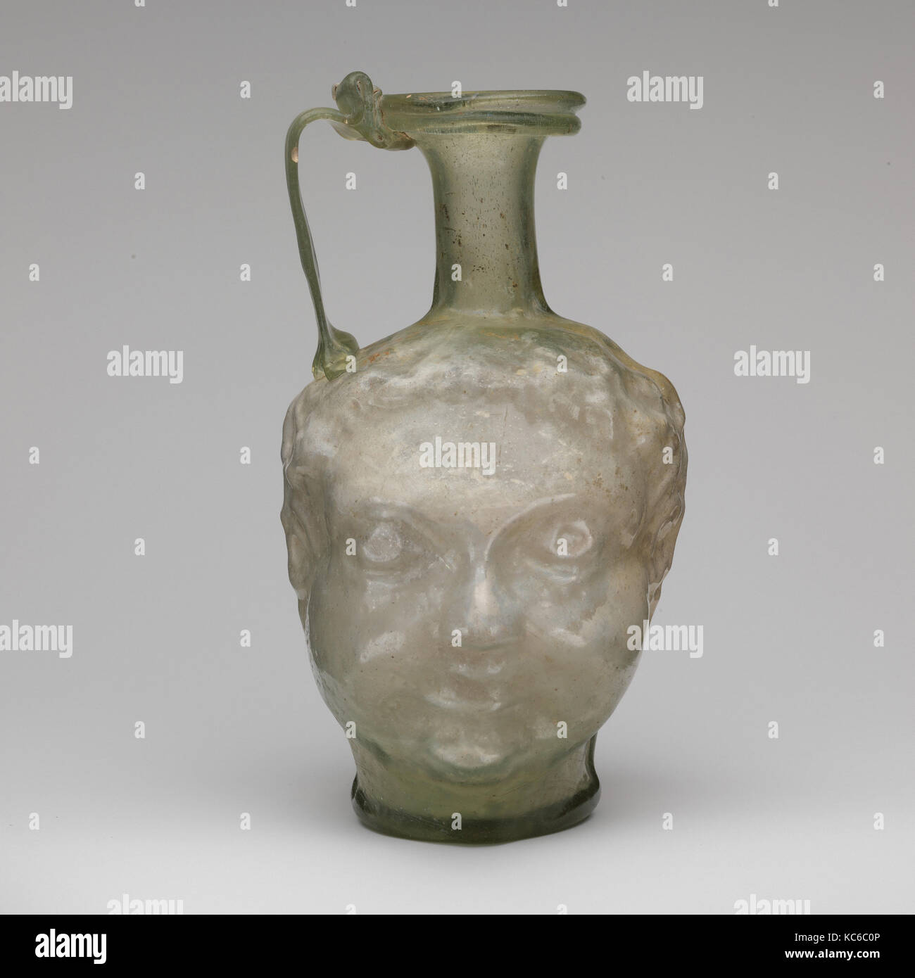 Glass double head-shaped jug, 1st half of 4th century A.D Stock Photo