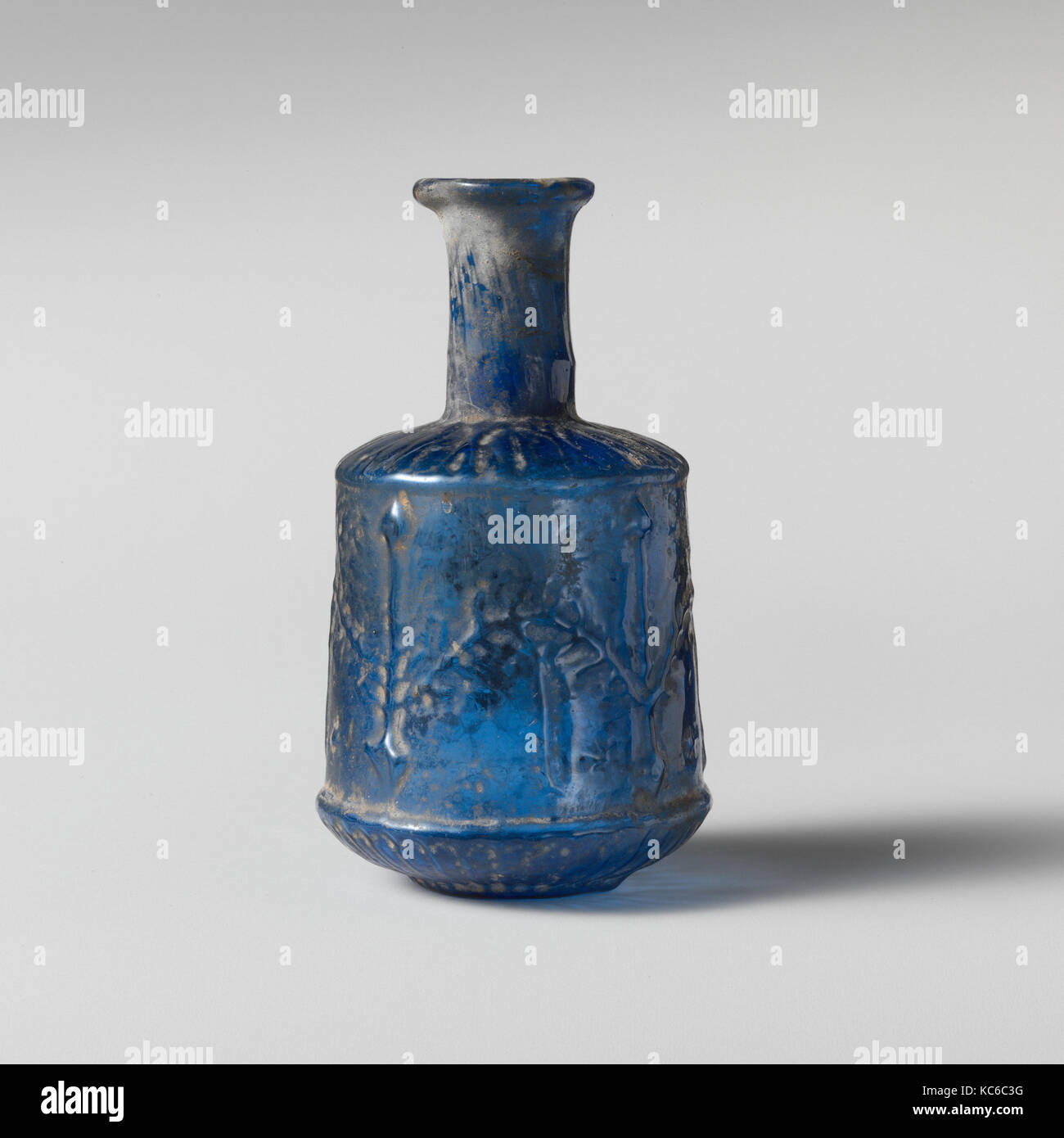 Glass bottle, Early Imperial, 1st century A.D., Roman, Glass; blown in a three-part mold, H.: 3 1/4 in. (8.3 cm), Glass Stock Photo