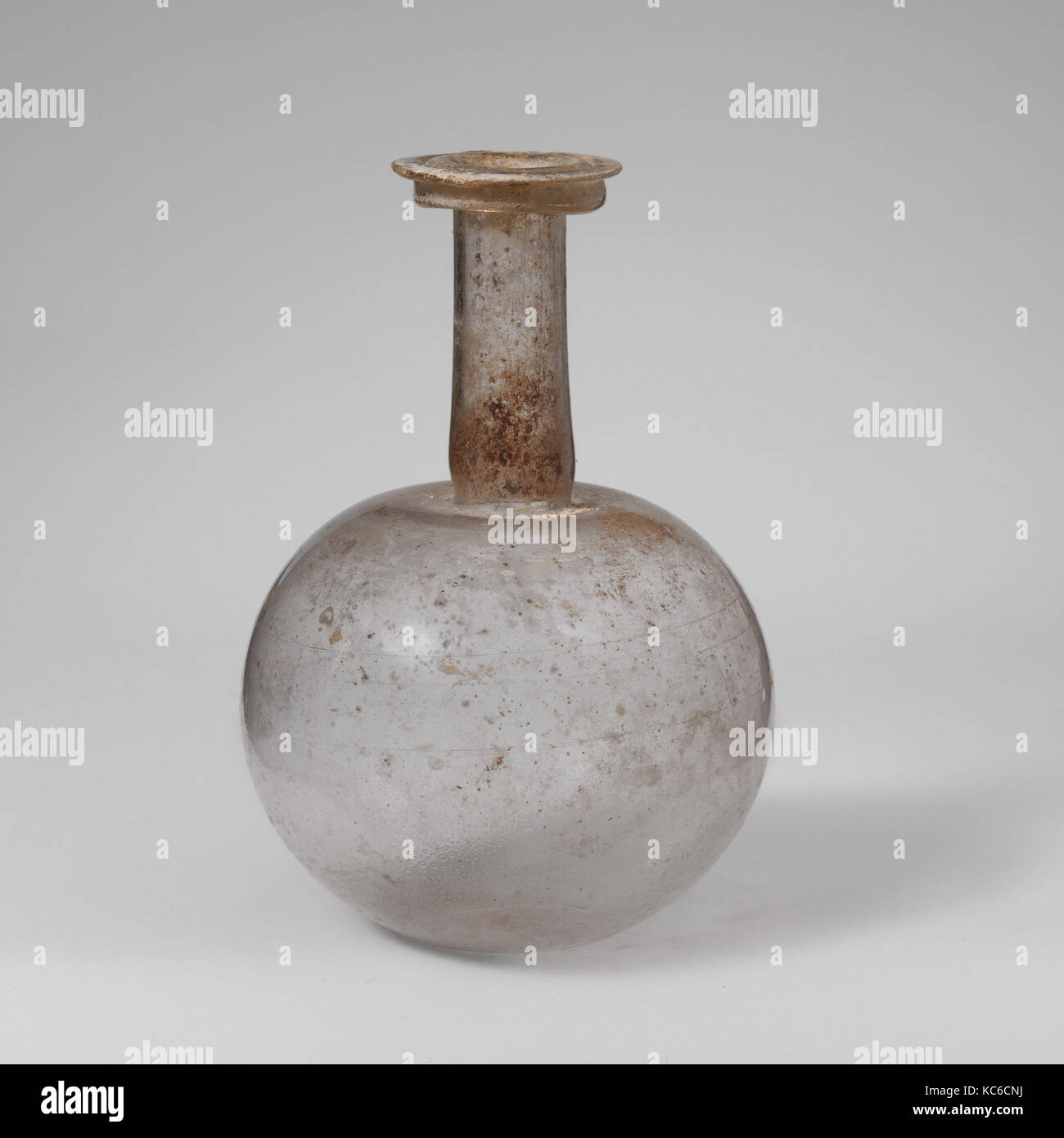Glass bottle, Early to Mid Imperial, mid-1st–2nd century A.D., Roman, Glass; blown and cut, 5 7/16 in. (13.8 cm), Glass Stock Photo