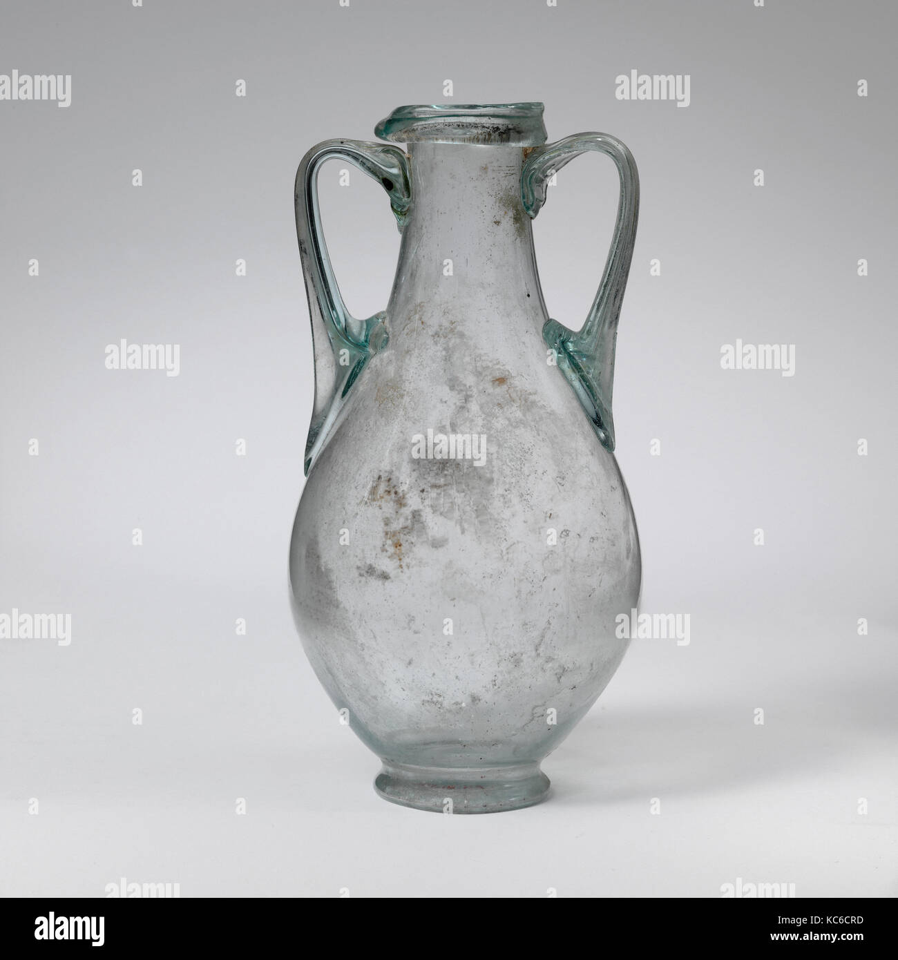 Glass amphora, Early Imperial, 1st century A.D., Roman, Glass; blown, 5 3/16 in. (13.2 cm), Glass, Translucent pale blue green Stock Photo