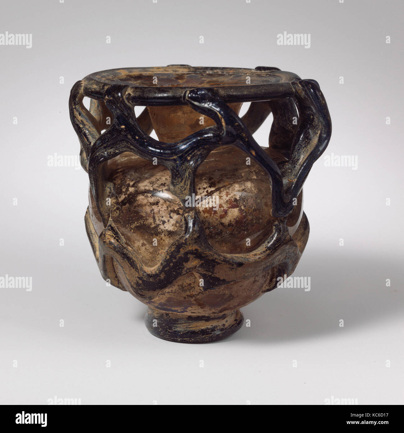 Glass jar, Late Imperial, 4th–5th century A.D., Roman, Syrian, Glass; blown and trailed, H.: 3 1/4 in. (8.3 cm), Glass Stock Photo