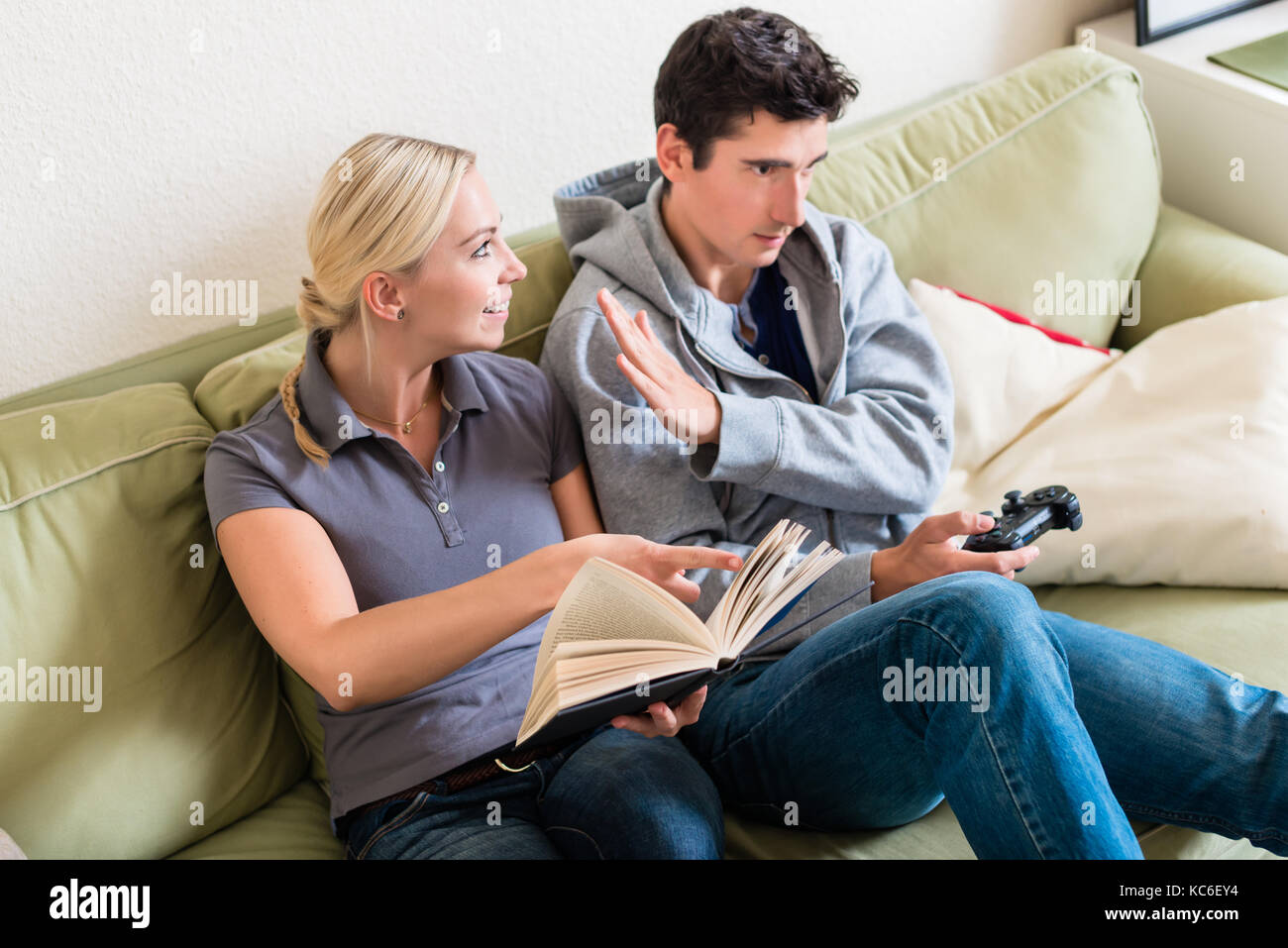 Man watching television and woman reading hi-res stock photography and  images - Alamy