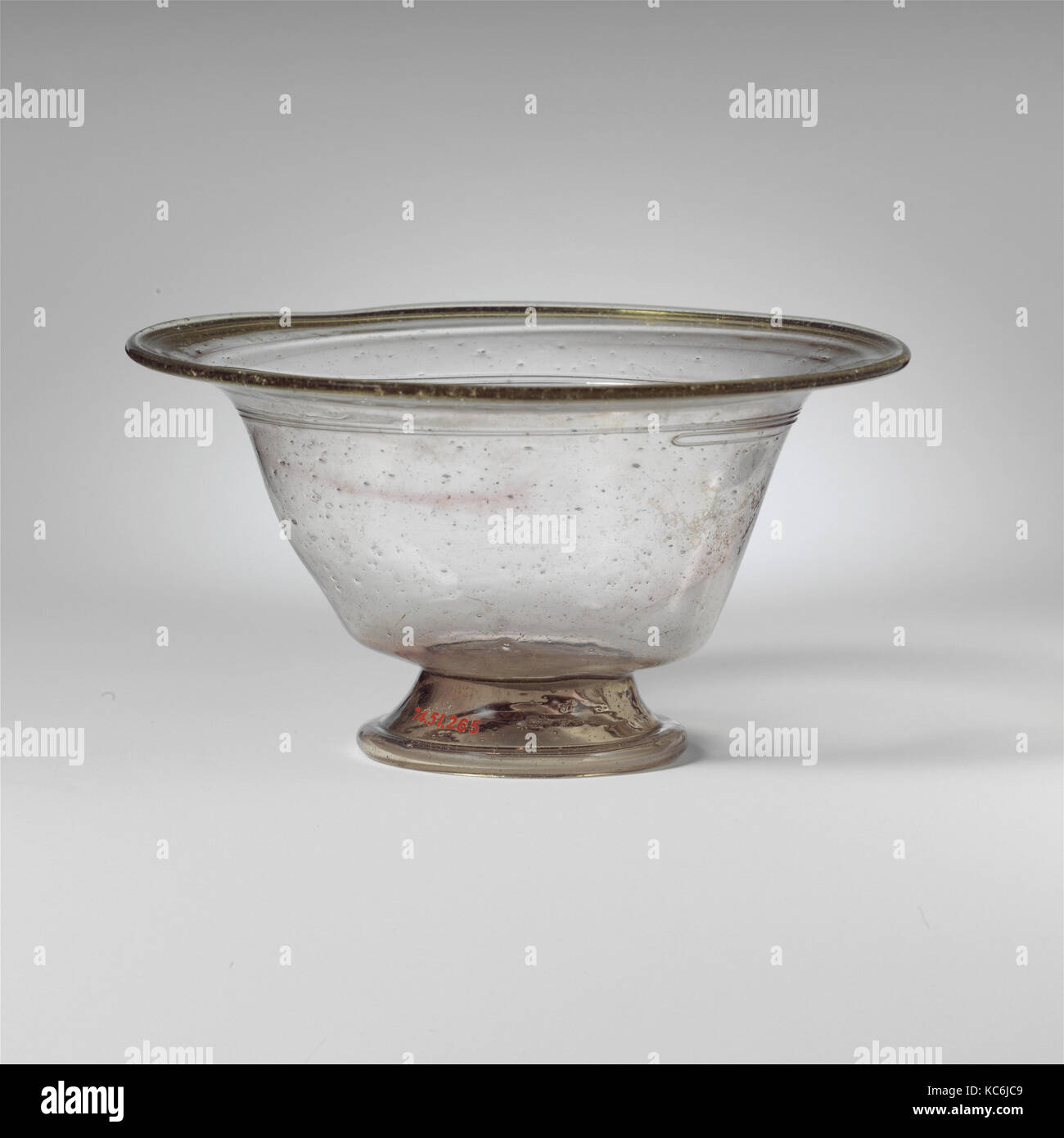 Glass bowl, Late Imperial, 4th century A.D., Roman, Glass; blown and trailed, 3 in. (7.6 cm), Glass, Colorless with pale green Stock Photo
