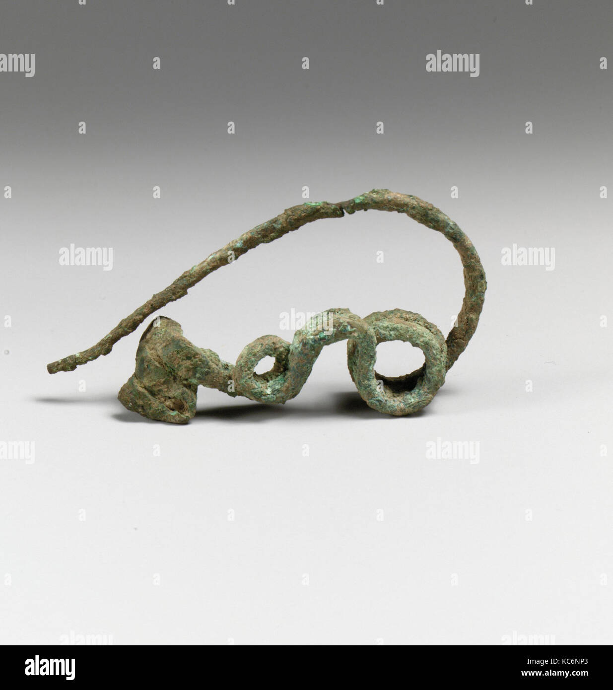 Fibula, serpentine type, Bronze, Other: 3 1/8 in. (7.9 cm), Bronzes Stock Photo