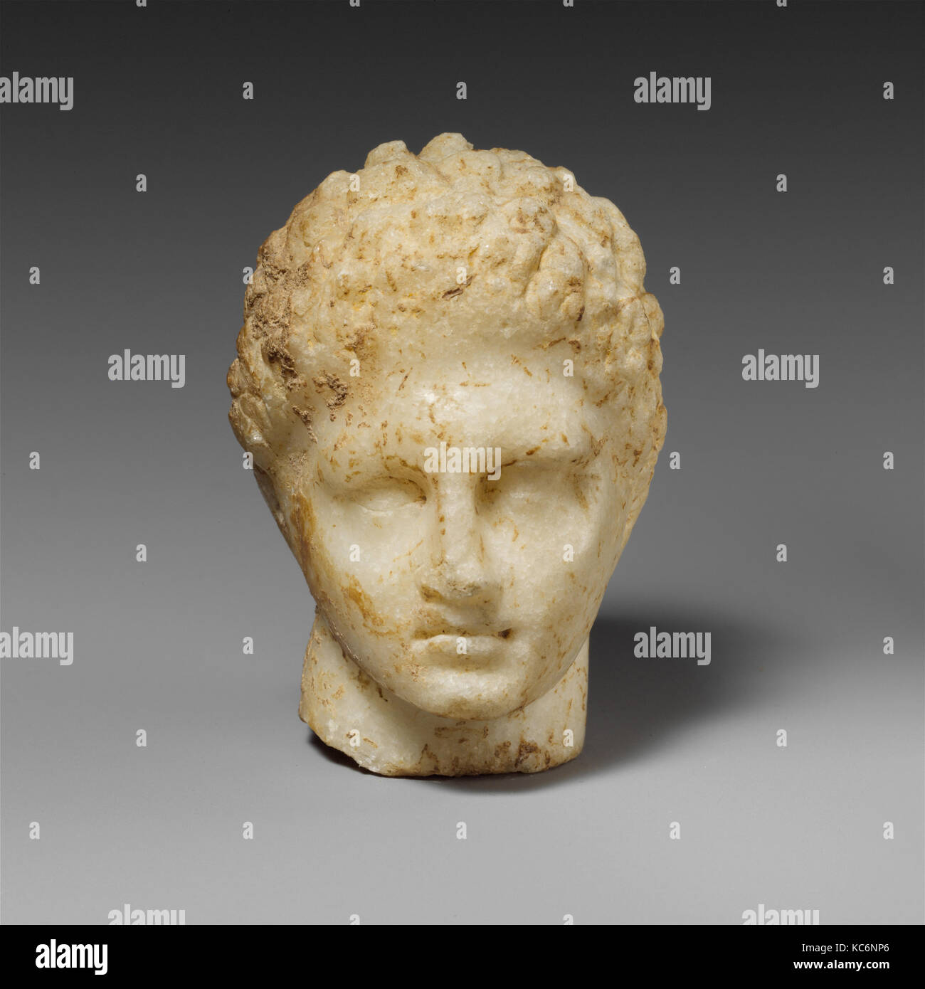 Marble head of a youth, Late Classical, 4th century B.C., Greek, Marble, Parian, H. 2 1/4 in. (5.7 cm.), Stone Sculpture, Small Stock Photo