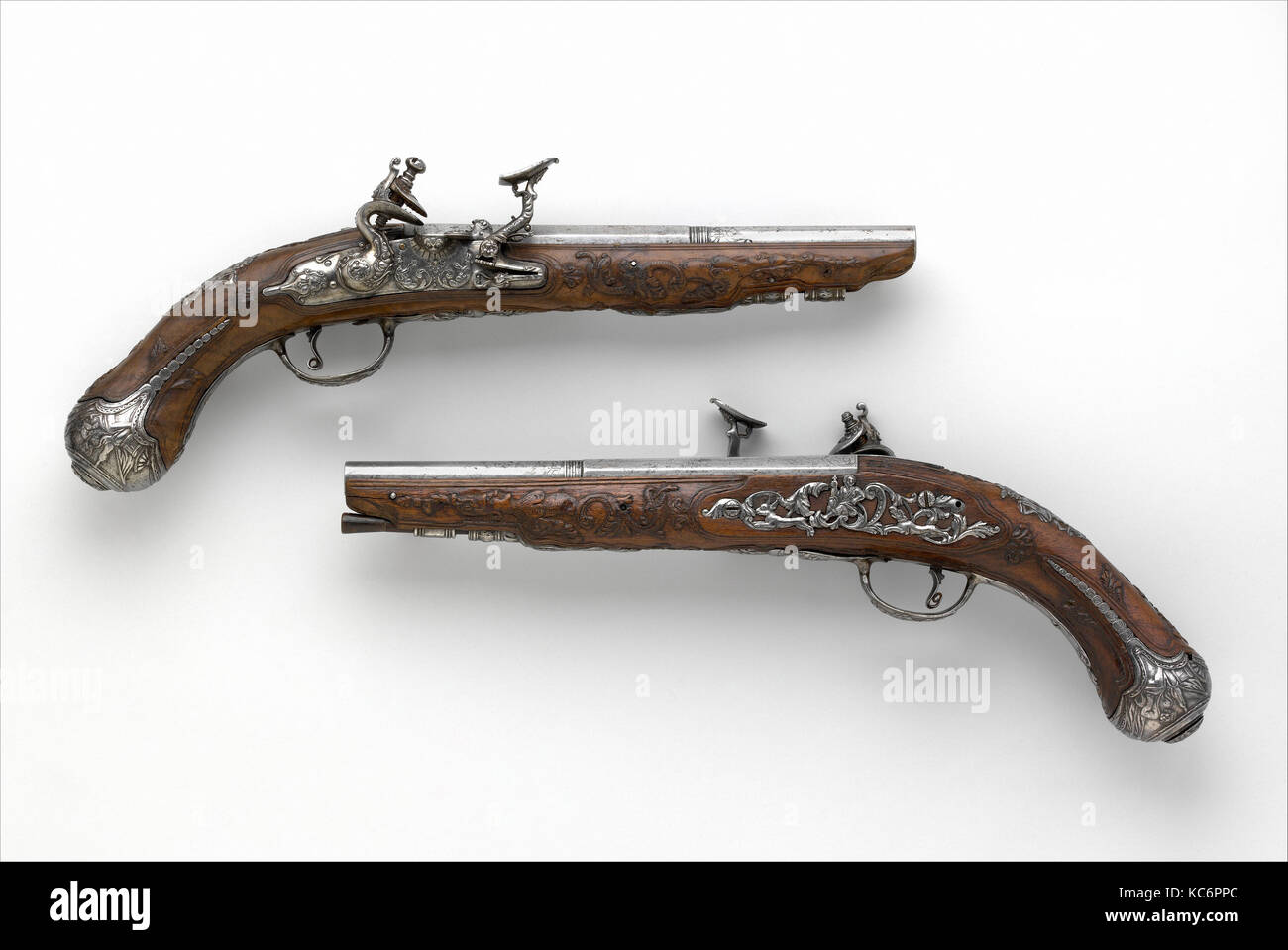 Pair of Snaphaunce Pistols, 1675, Italian (Brescian), Wood (walnut), steel, L. 14 1/2 in. (36.8 cm); L. of barrel 8 3/8 in. (21 Stock Photo
