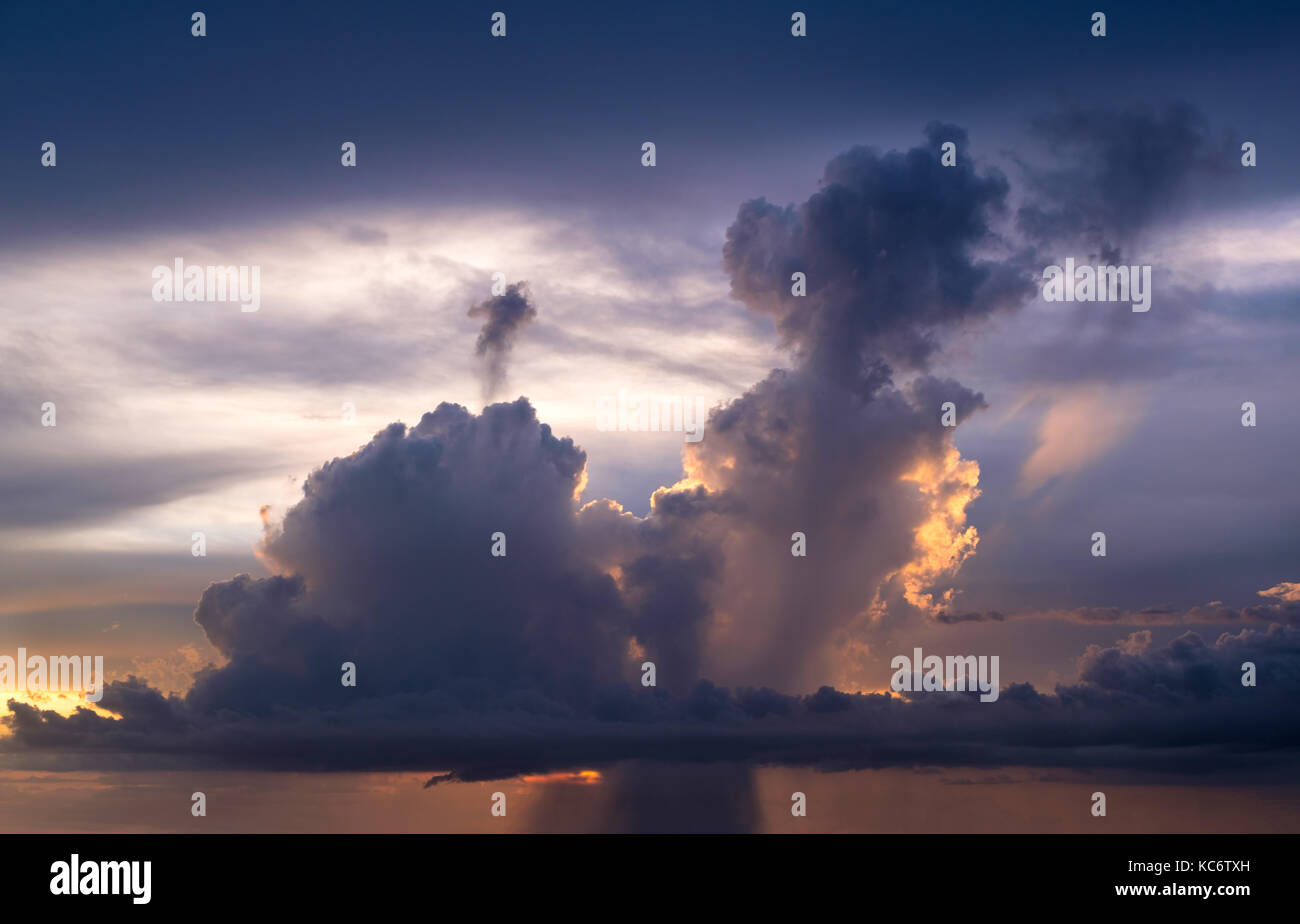 Storm cloud at sunset Stock Photo