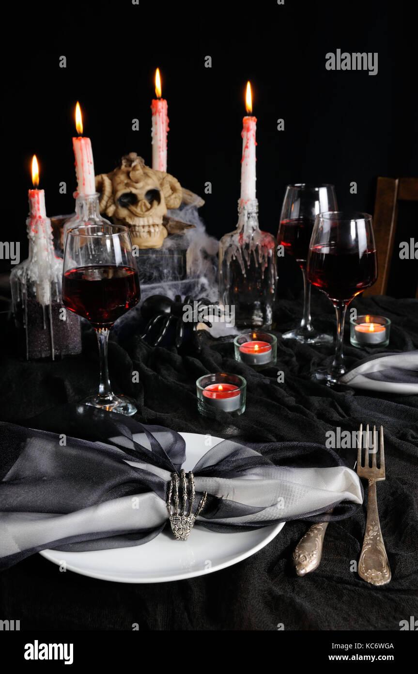 Napkin with a clip in the form of a skeleton of a brush as an element of a decor of a holiday table for Halloween Stock Photo